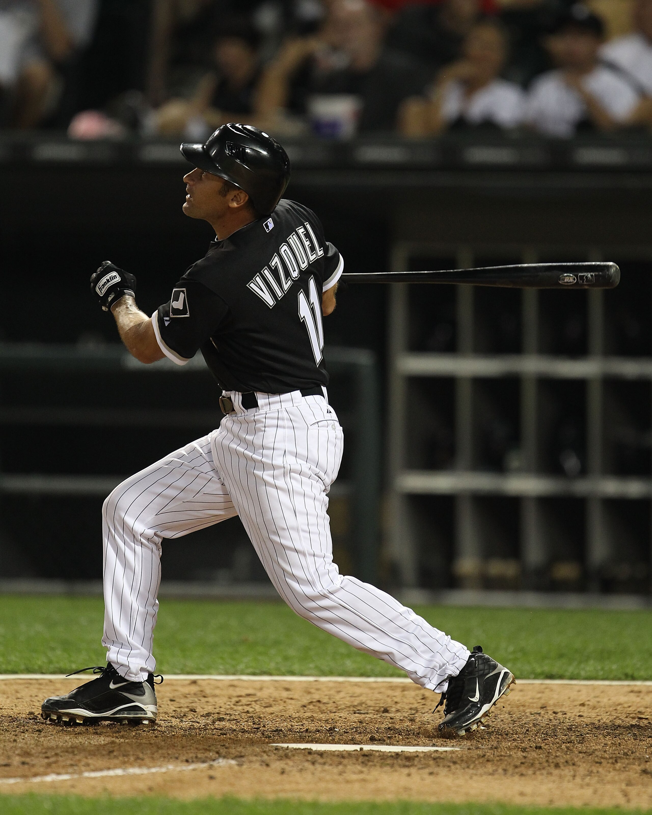 CHICAGO - AUGUST 10: Omar Vizquel #11 of the Chicago White Sox takes a swing against the Minnesota Twins at U.S. Cellular Field on August 10, 2010 in Chicago, Illinois. The Twins defeated the White Sox 12-6. (Photo by Jonathan Daniel/Getty Images)