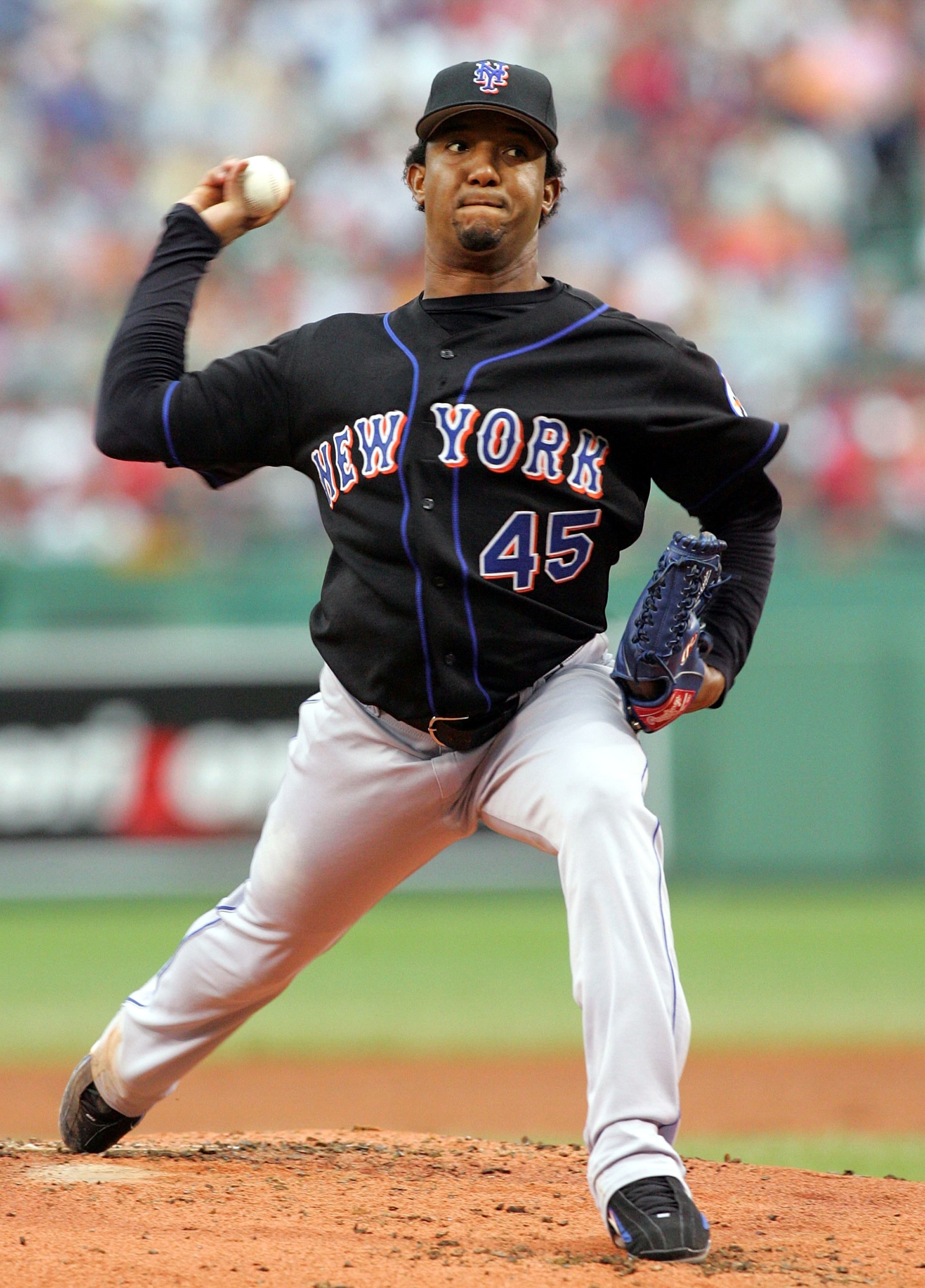 BOSTON - JUNE 28:  (FILE PHOTO)  Pedro Martinez #45 of the New York Mets pitches against the Boston Red Sox June 28, 2006 at Fenway Park in Boston Massachusetts. According to reports, Martinez is out for the postseason due to a torn tendon in his left cal