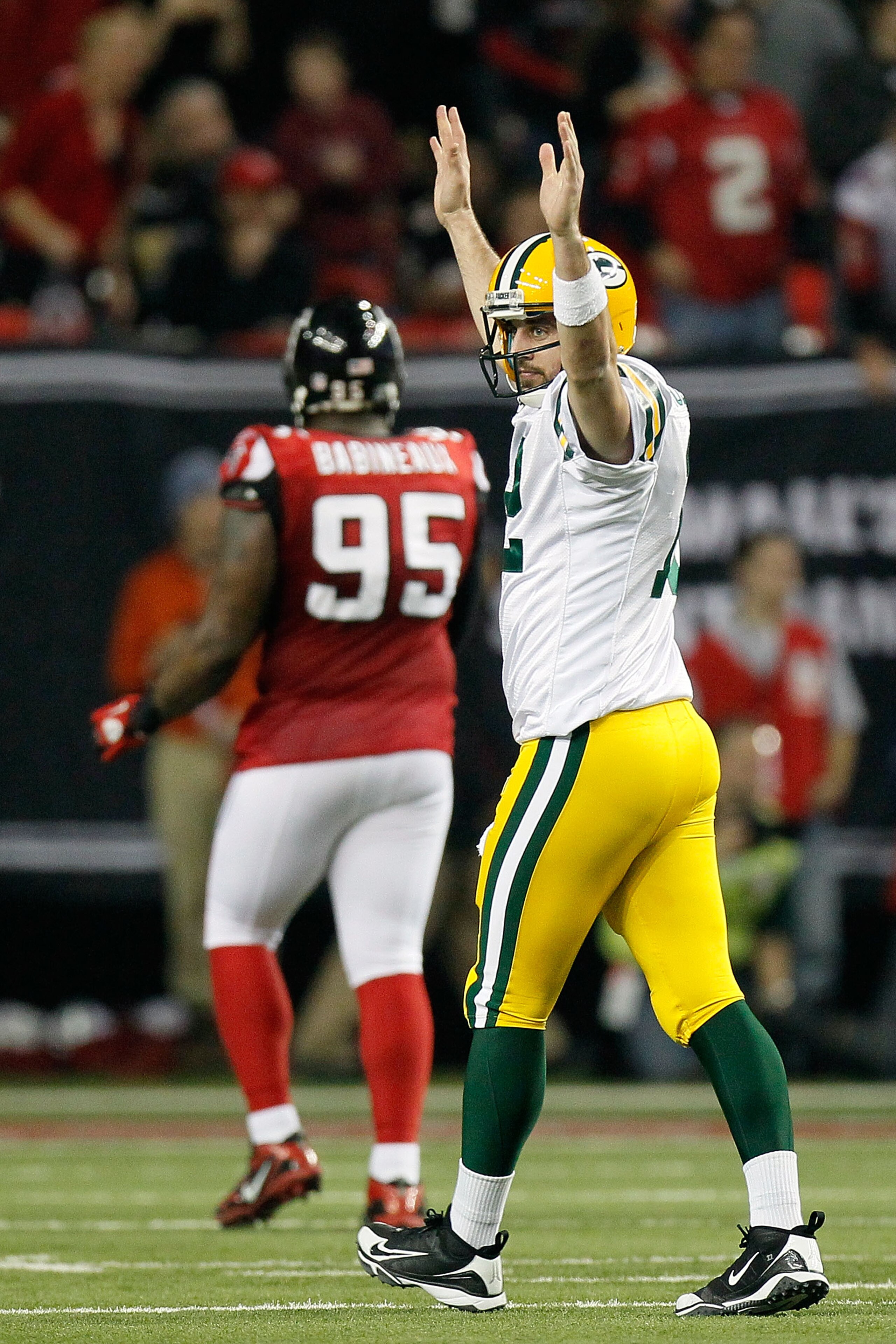 ATLANTA, GA - JANUARY 15:  Quarterback Aaron Rodgers #12 of the Green Bay Packers celebrates after he threw a 20-yard touchdown pass to James Jones #89 in the seocnd quarter against the Atlanta Falcons during their 2011 NFC divisional playoff game at Geor