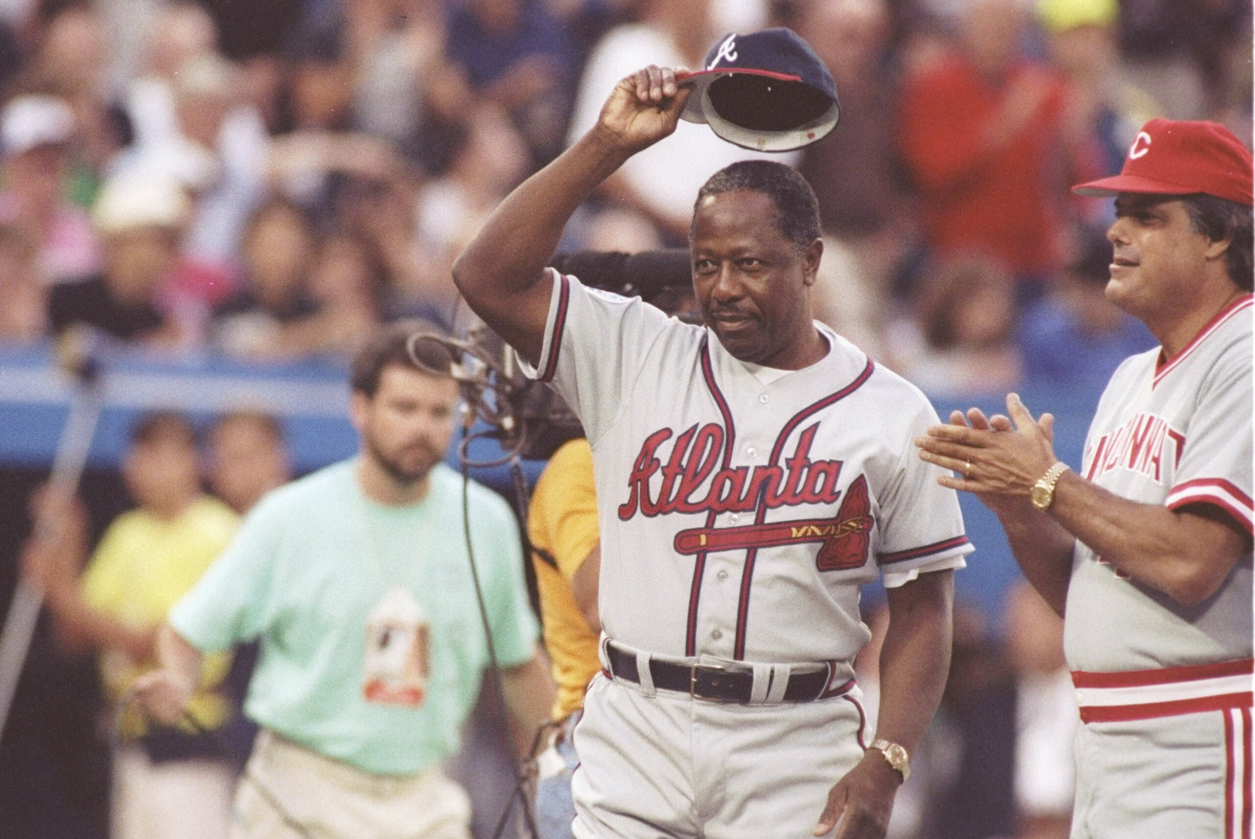9 Jul 1991:  Hank Aaron of the Atlanta Braves (center) doffs his hat at the All-Star Game at the Toronto Sky Dome in Toronto, Canada. Mandatory Credit: Rick Stewart  /Allsport