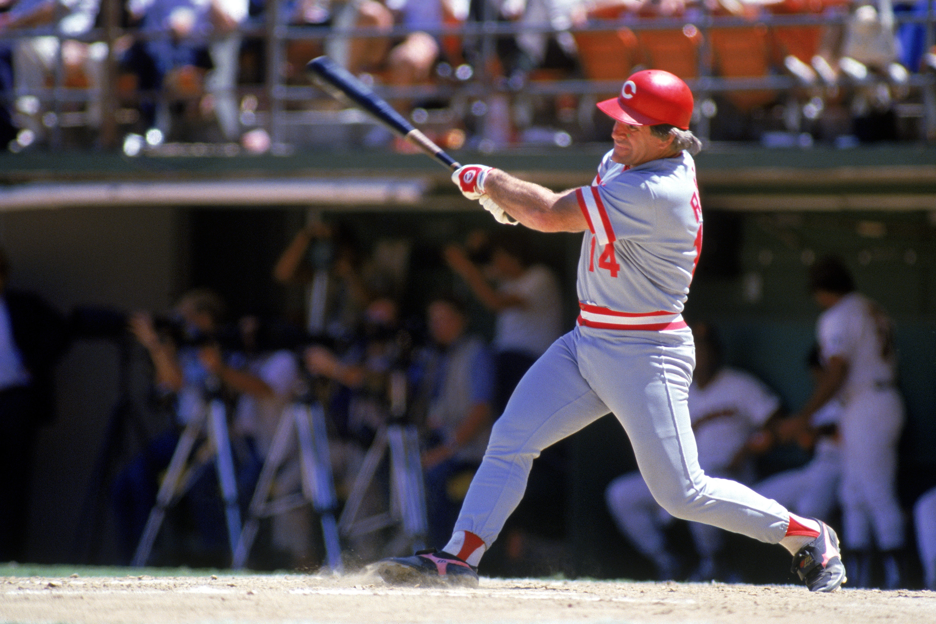 SAN DIEGO, CA - 1986:  Pete Rose #14 of the Cincinnati Reds swings at a pitch during a game against the San Diego Padres at Jack Murphy Stadium in the 1986 MLB season in San Diego, California.  (Photo by Stephen Dunn/Getty Images)