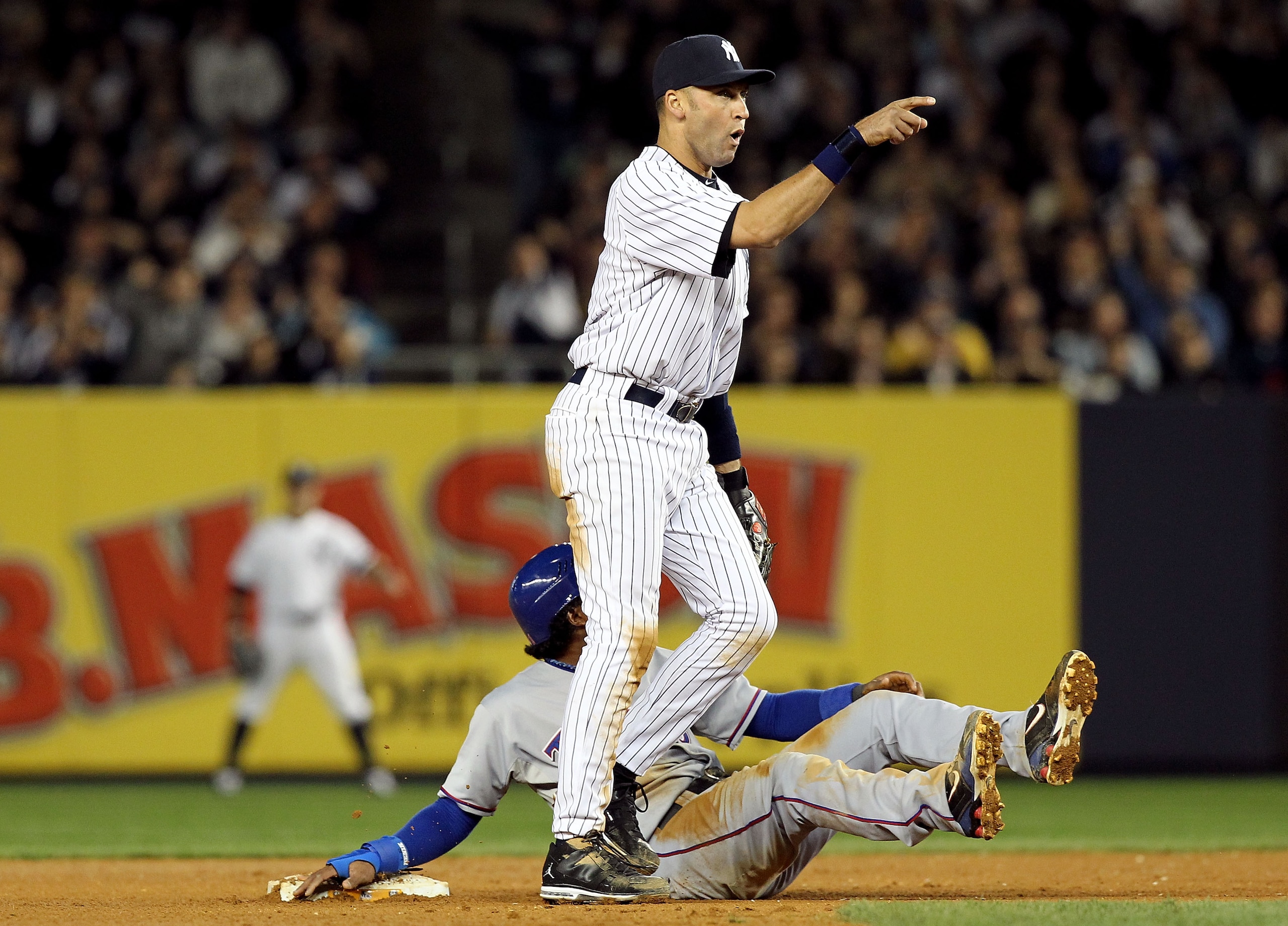 NEW YORK - OCTOBER 20:  Derek Jeter #2 of the New York Yankees reacts after he tagged out Elvis Andrus #1 of the Texas Rangers on a pickoff play at second base in the top of the seventh inninng of Game Five of the ALCS during the 2010 MLB Playoffs at Yank