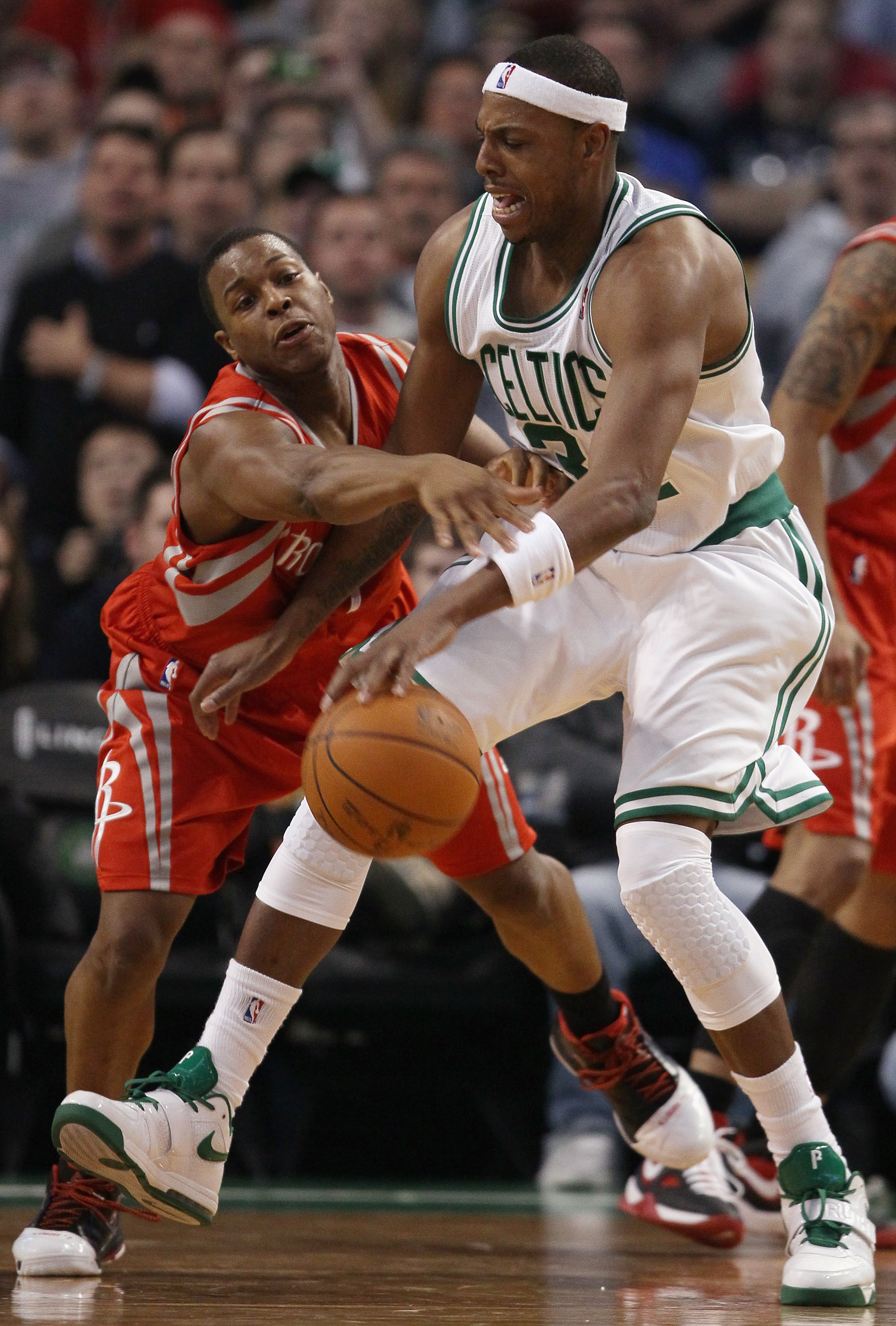 BOSTON, MA - JANUARY 10:  Paul Pierce #34 of the Boston Celtics tries to get around Kyle Lowry #7 of the Houston Rockets on January 10, 2011 at the TD Garden in Boston, Massachusetts.  The Rockets defeated the Celtics 108-102. NOTE TO USER: User expressly