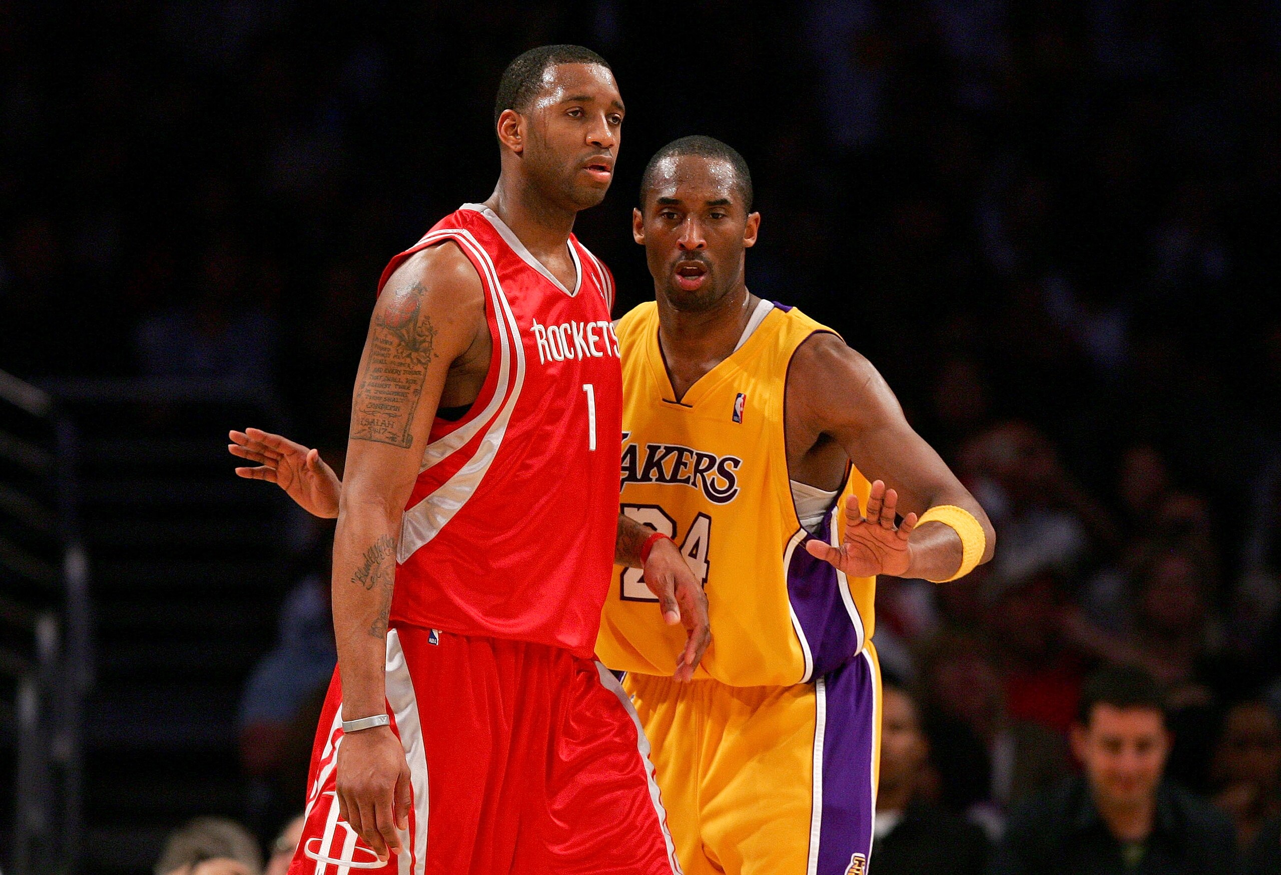 LOS ANGELES, CA - MARCH 30: Kobe Bryant #24 of the Los Angeles Lakers battles for position against Tracy McGrady #1 of the Houston Rockets at Staples Center on March 30, 2007 in Los Angeles, California.  NOTE TO USER: User expressly acknowledges and agree