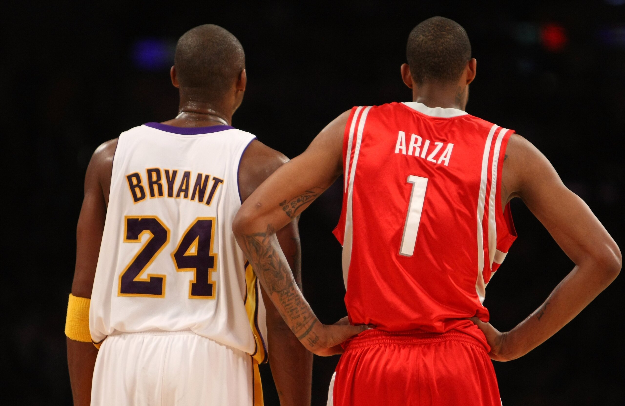 LOS ANGELES, CA - NOVEMBER 15:  Kobe Bryant #24 of the Los Angeles Lakers stands byTrevor Ariza #1 of the Houston Rockets on November 15, 2009 at Staples Center in Los Angeles, California.  The Rockets won 101-91.  NOTE TO USER: User expressly acknowledge