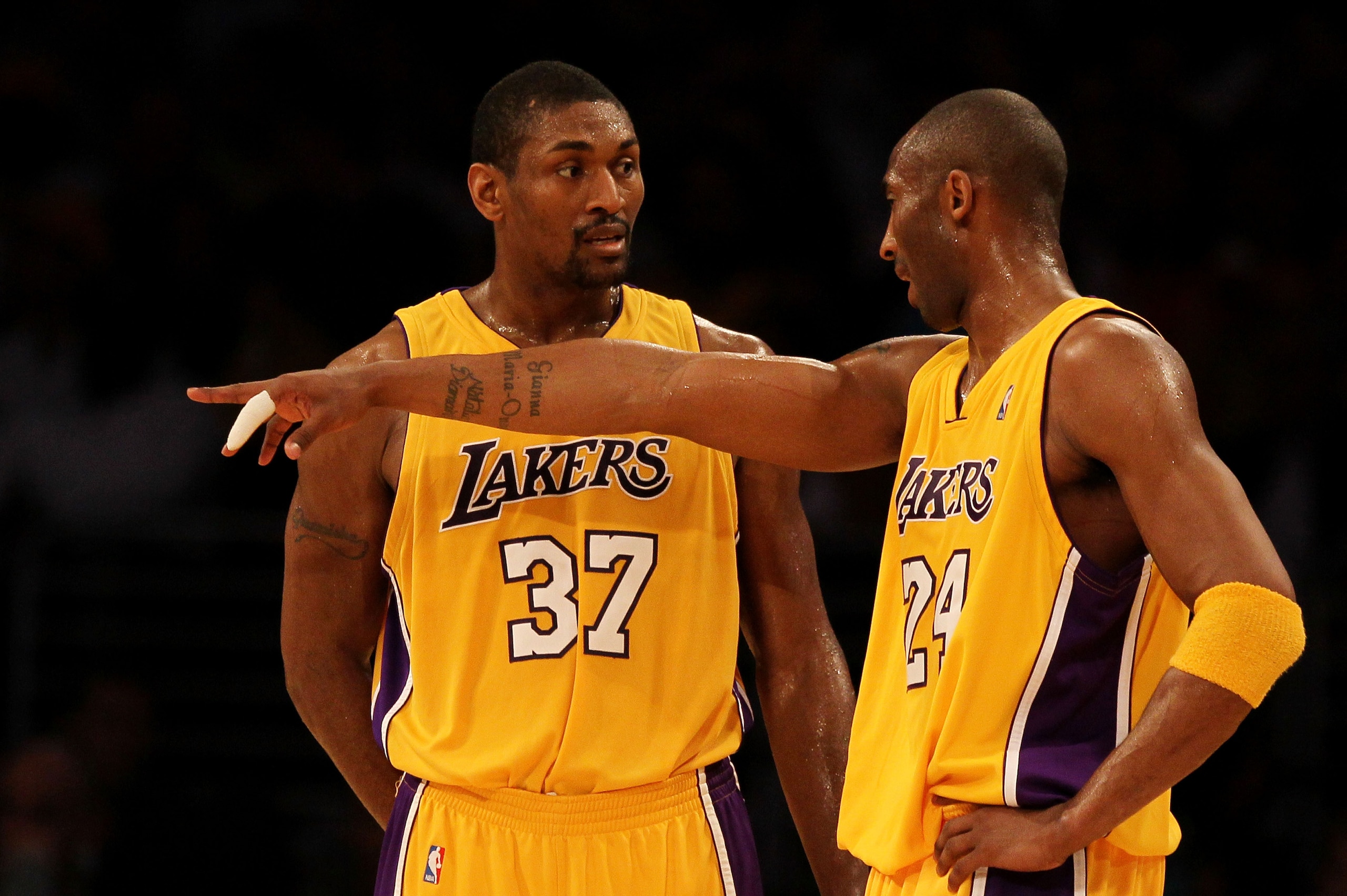 LOS ANGELES, CA - MAY 19:  Kobe Bryant #24 of the Los Angeles Lakers speaks with teammate Ron Artest #37 during the stop in play against the Phoenix Suns in Game Two of the Western Conference Finals during the 2010 NBA Playoffs at Staples Center on May 19