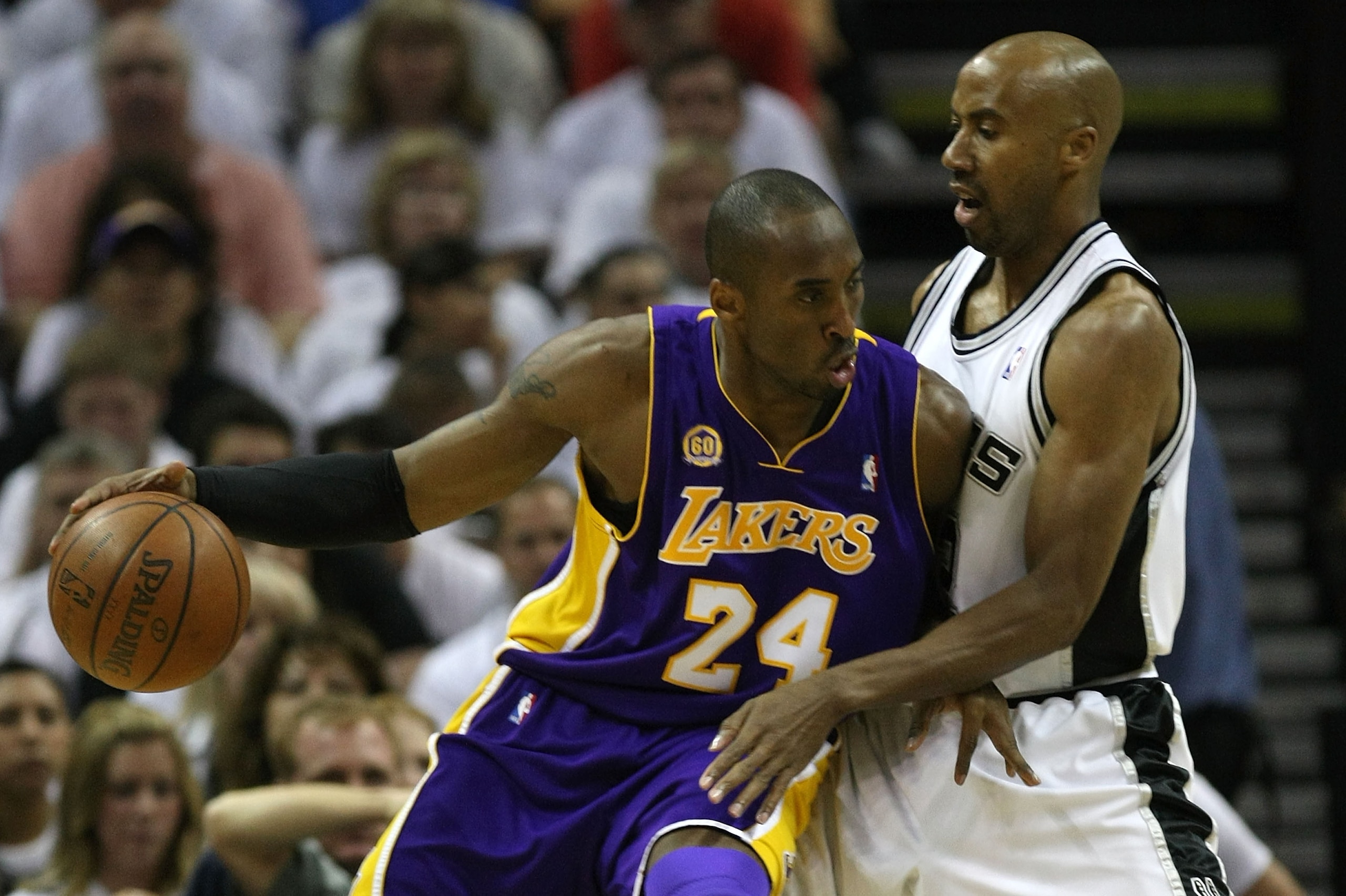 SAN ANTONIO - MAY 27:  Kobe Bryant #24 of the Los Angeles Lakers posts up Bruce Bowen #12 of the San Antonio Spurs in the first quarter of Game Four of the Western Conference Finals during the 2008 NBA Playoffs on May 27, 2008 at the AT&T Center in San An
