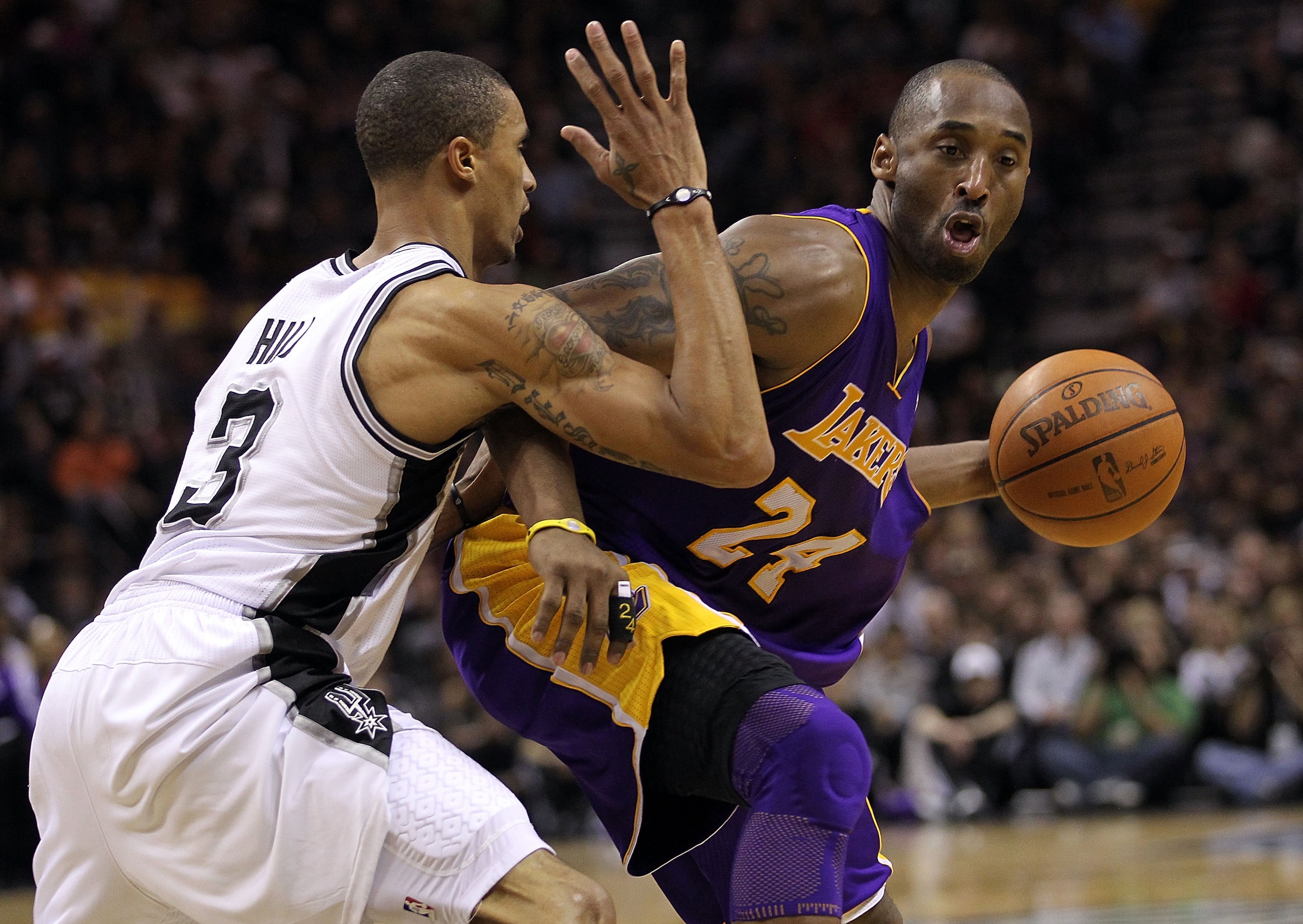 SAN ANTONIO, TX - DECEMBER 28:  Guard Kobe Bryant #24 of the Los Angeles Lakers dribbles the ball against George Hill #3 of the San Antonio Spurs at AT&T Center on December 28, 2010 in San Antonio, Texas.  NOTE TO USER: User expressly acknowledges and agr
