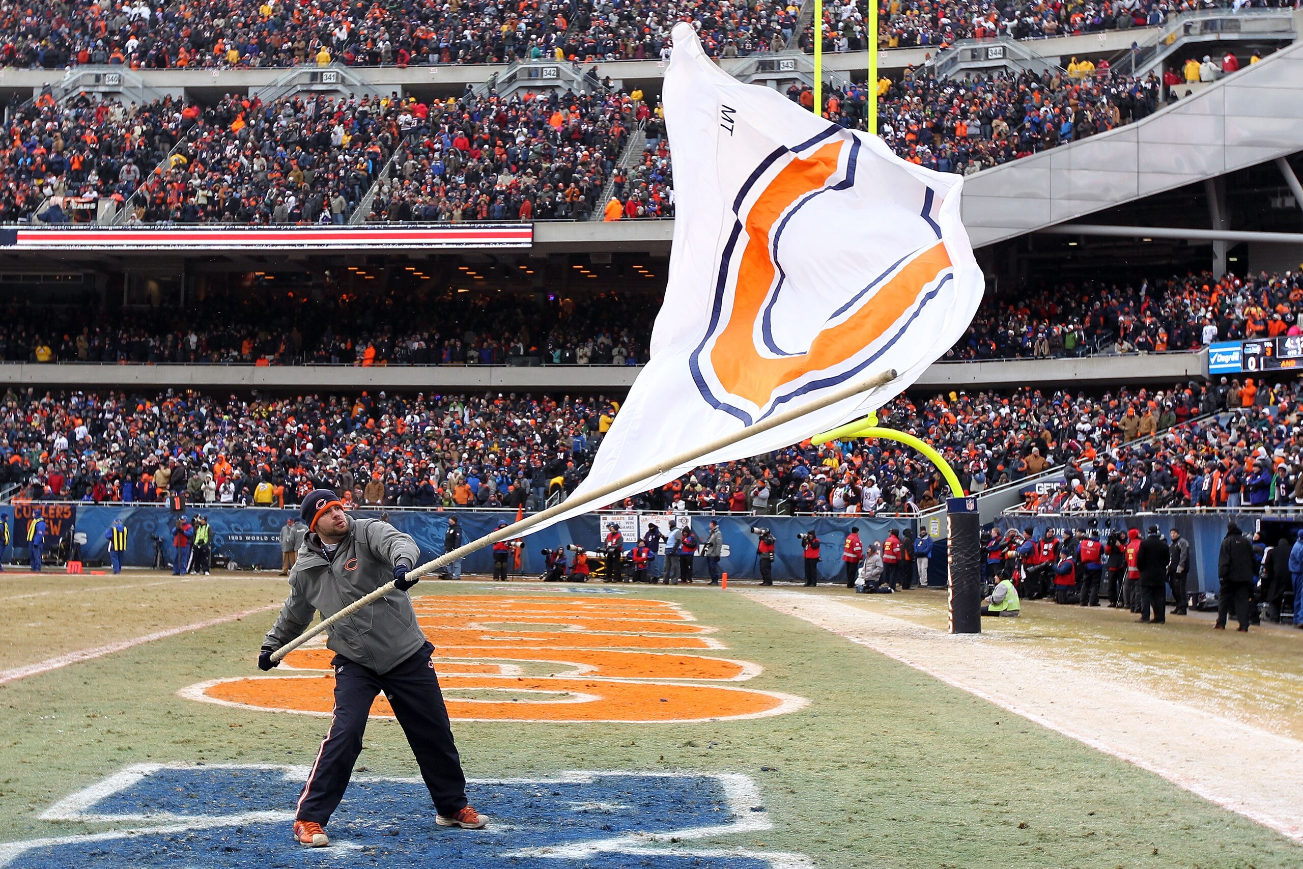 CHICAGO, IL - JANUARY 16:  A member of the on-field team waves a Bears fan during the 2011 NFC divisional playoff game between the Seattle Seahawks and the Chicago Bears at Soldier Field on January 16, 2011 in Chicago, Illinois.  (Photo by Andy Lyons/Gett