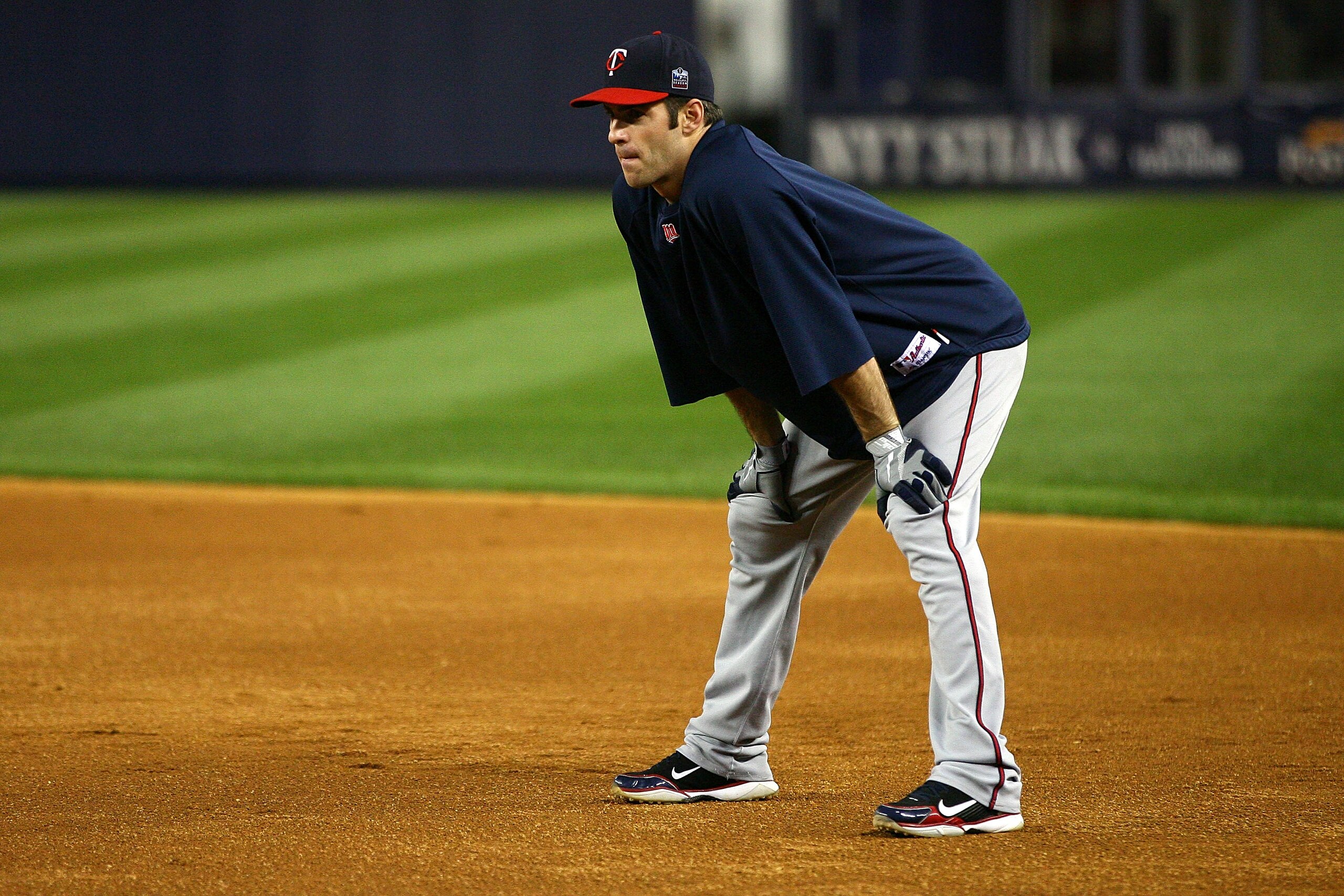 NEW YORK - OCTOBER 09:  Joe Mauer #7 of the Minnesota Twins looks on during batting practice against the New York Yankees during Game Three of the ALDS part of the 2010 MLB Playoffs at Yankee Stadium on October 9, 2010 in the Bronx borough of New York Cit