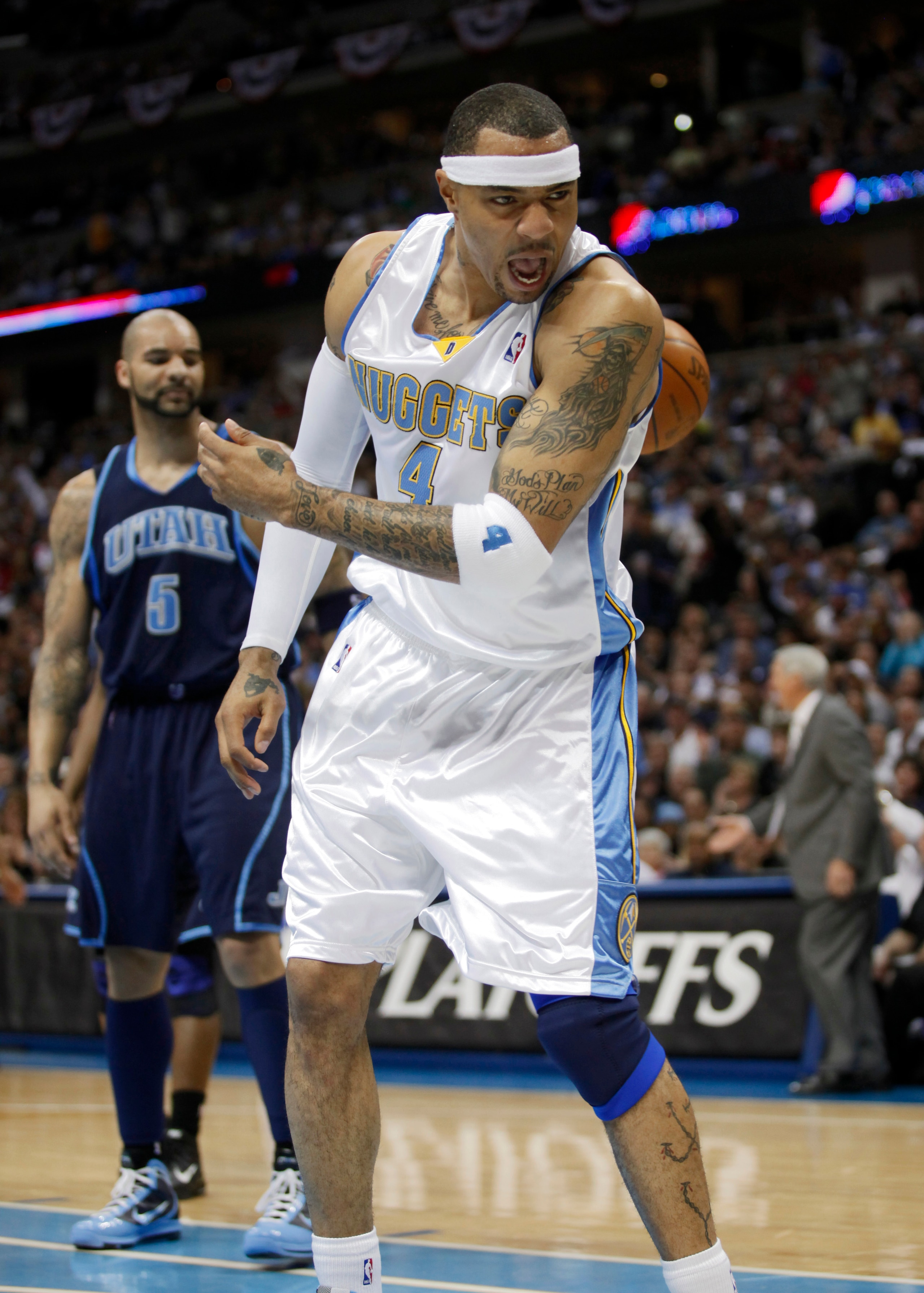DENVER, CO - APRIL 17 : Kenyon Martin #4 of the Denver Nuggets reacts after dunking the ball in front of Carlos Boozer #5 of the Utah Jazz during the first half of Game One of the Western Conference Quarterfinals of the 2010 NBA Playoffs at the Pepsi Cent