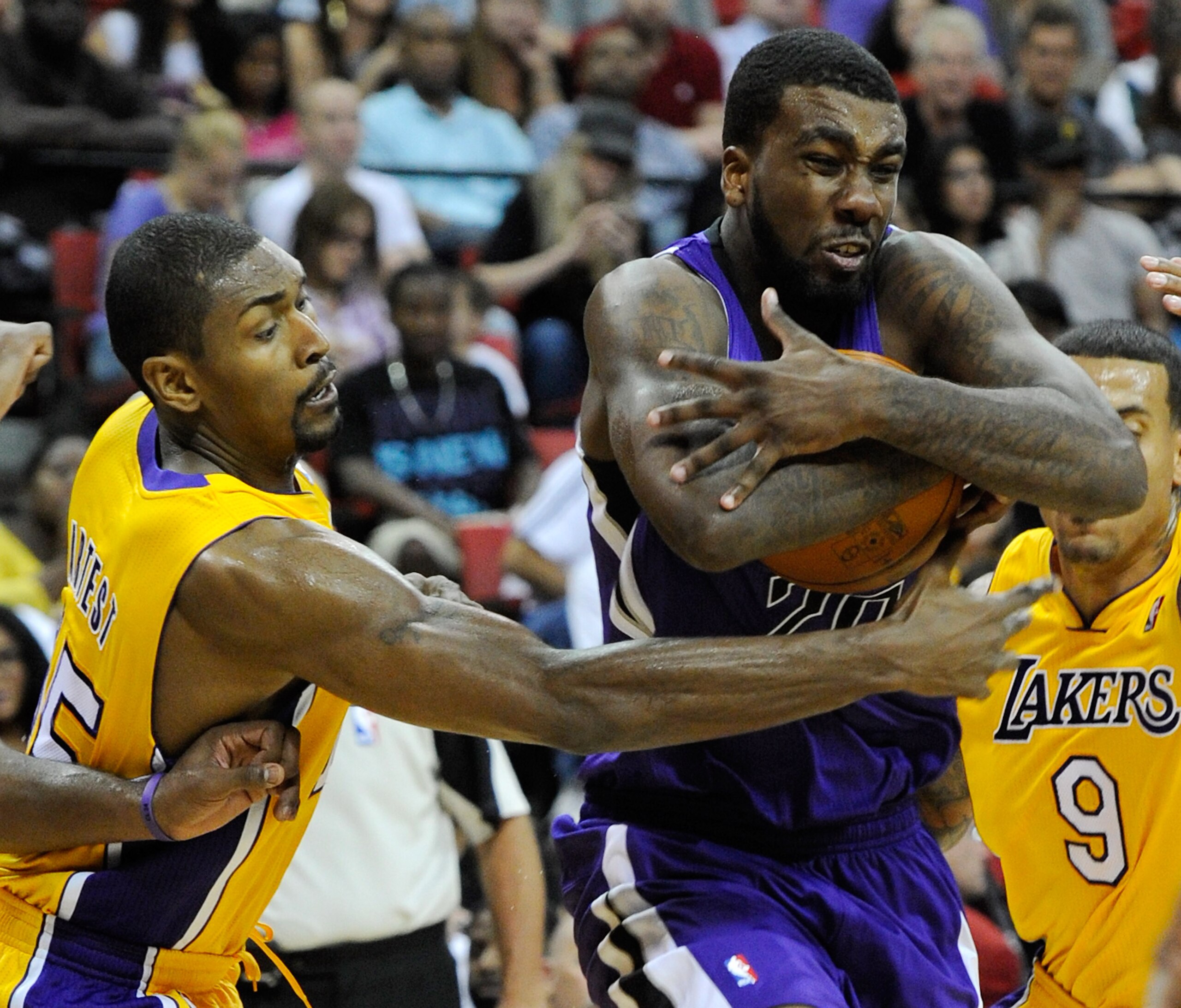 LAS VEGAS - OCTOBER 13:  Ron Artest #15 of the Los Angeles Lakers tries to steal the ball from Donte Greene #20 of the Sacramento Kings during their preseason game at the Thomas & Mack Center October 13, 2010 in Las Vegas, Nevada. The Lakers won 98-95. NO