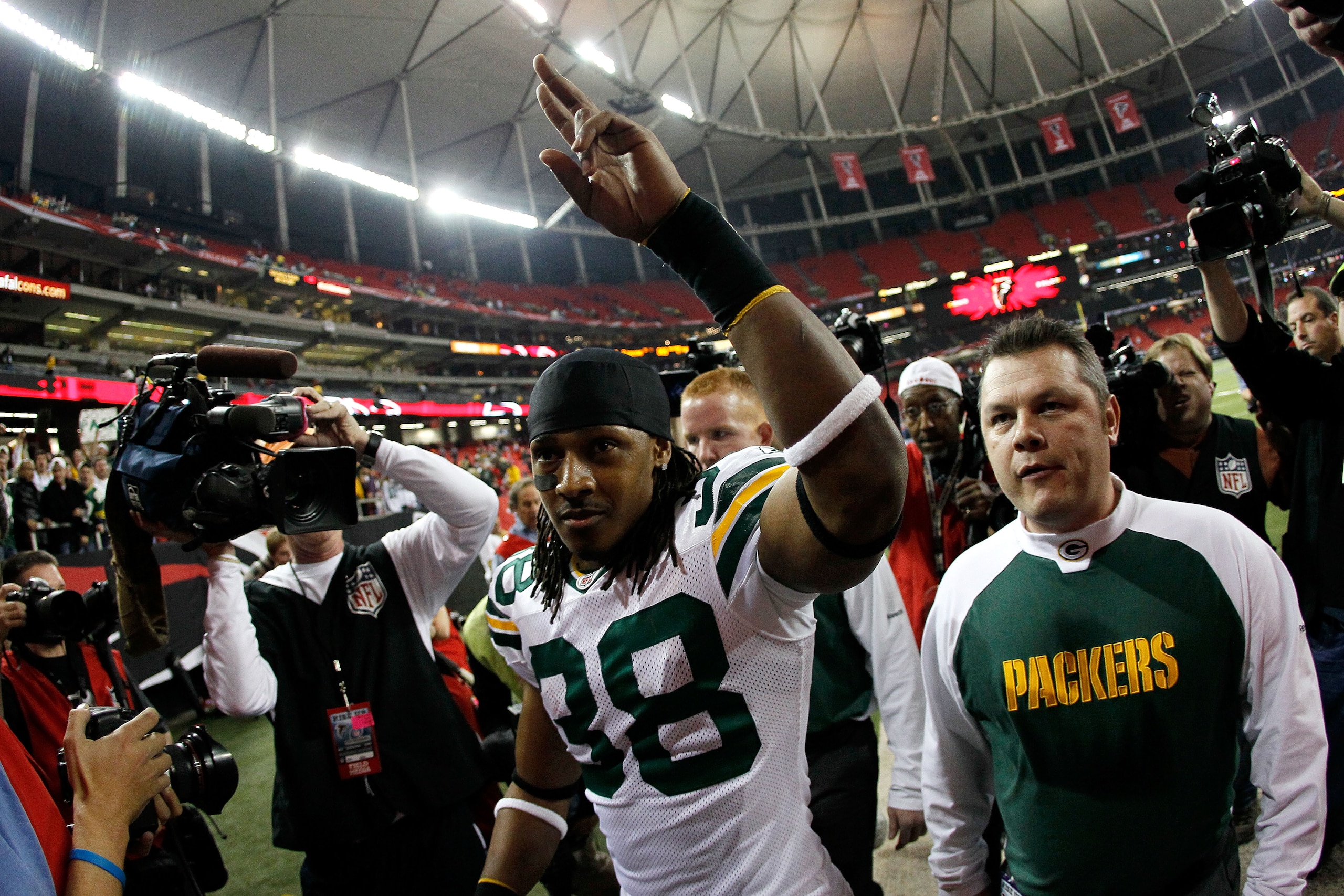 ATLANTA, GA - JANUARY 15:  Tramon Williams #38 of the Green Bay Packers celebrates as he walks off of the field after the Packers won 48-21 against the Atlanta Falcons during their 2011 NFC divisional playoff game at Georgia Dome on January 15, 2011 in At