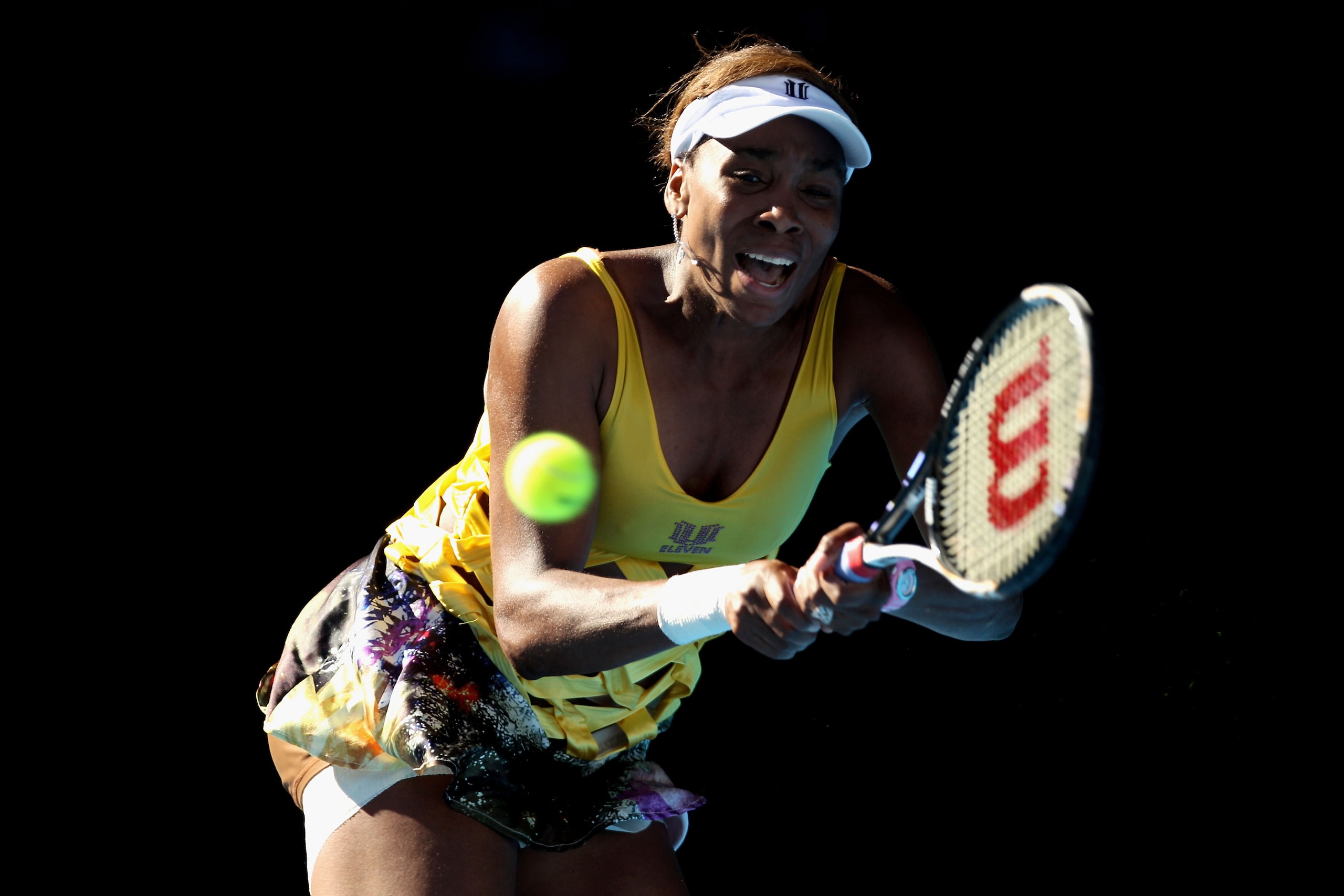 MELBOURNE, AUSTRALIA - JANUARY 19:  Venus Williams of the United States of America plays a backhand in her second round match against Sandra Zahlavova of the Czech Republic during day three of the 2011 Australian Open at Melbourne Park on January 19, 2011