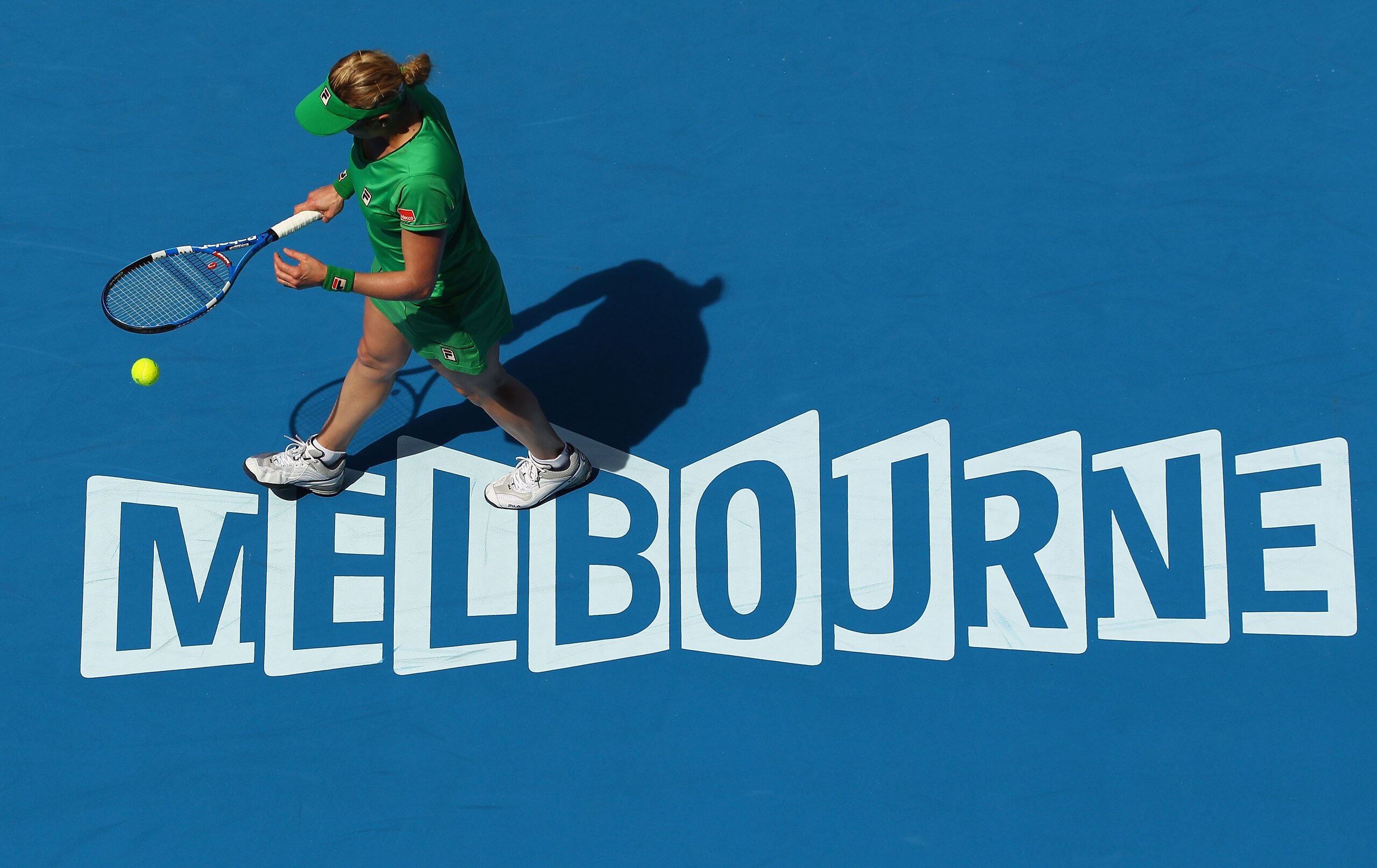 MELBOURNE, AUSTRALIA - JANUARY 20:  Kim Clijsters of Belgium prepares to serve in her second round match against Carla Suarez Navarro of Spain during day four of the 2011 Australian Open at Melbourne Park on January 20, 2011 in Melbourne, Australia.  (Pho