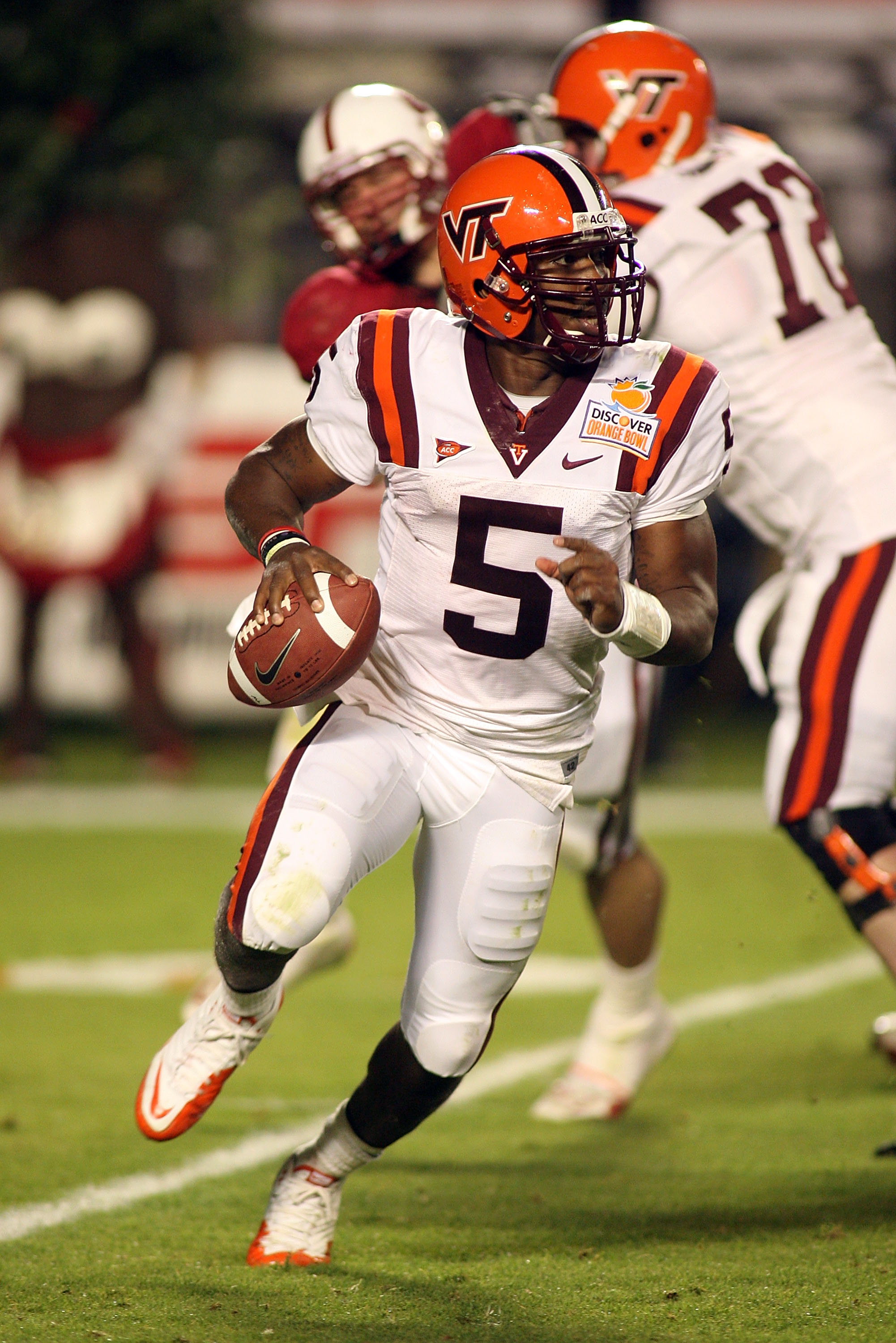MIAMI, FL - JANUARY 03: Tyrod Taylor #5 of the Virginia Tech Hokies rolls out of the pocket against the Stanford Cardinal during the 2011 Discover Orange Bowl at Sun Life Stadium on January 3, 2011 in Miami, Florida. Stanford won 40-12. (Photo by Marc Se