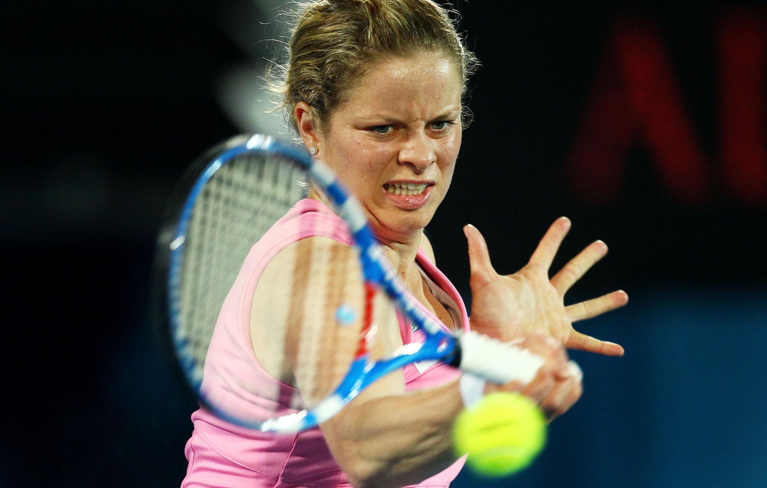 SYDNEY, AUSTRALIA - JANUARY 14: Kim Clijsters of Belgium plays a forehand in the womens final against Na Li of China during day six of the 2011 Medibank International at Sydney Olympic Park Tennis Centre on January 14, 2011 in Sydney, Australia.  (Photo b