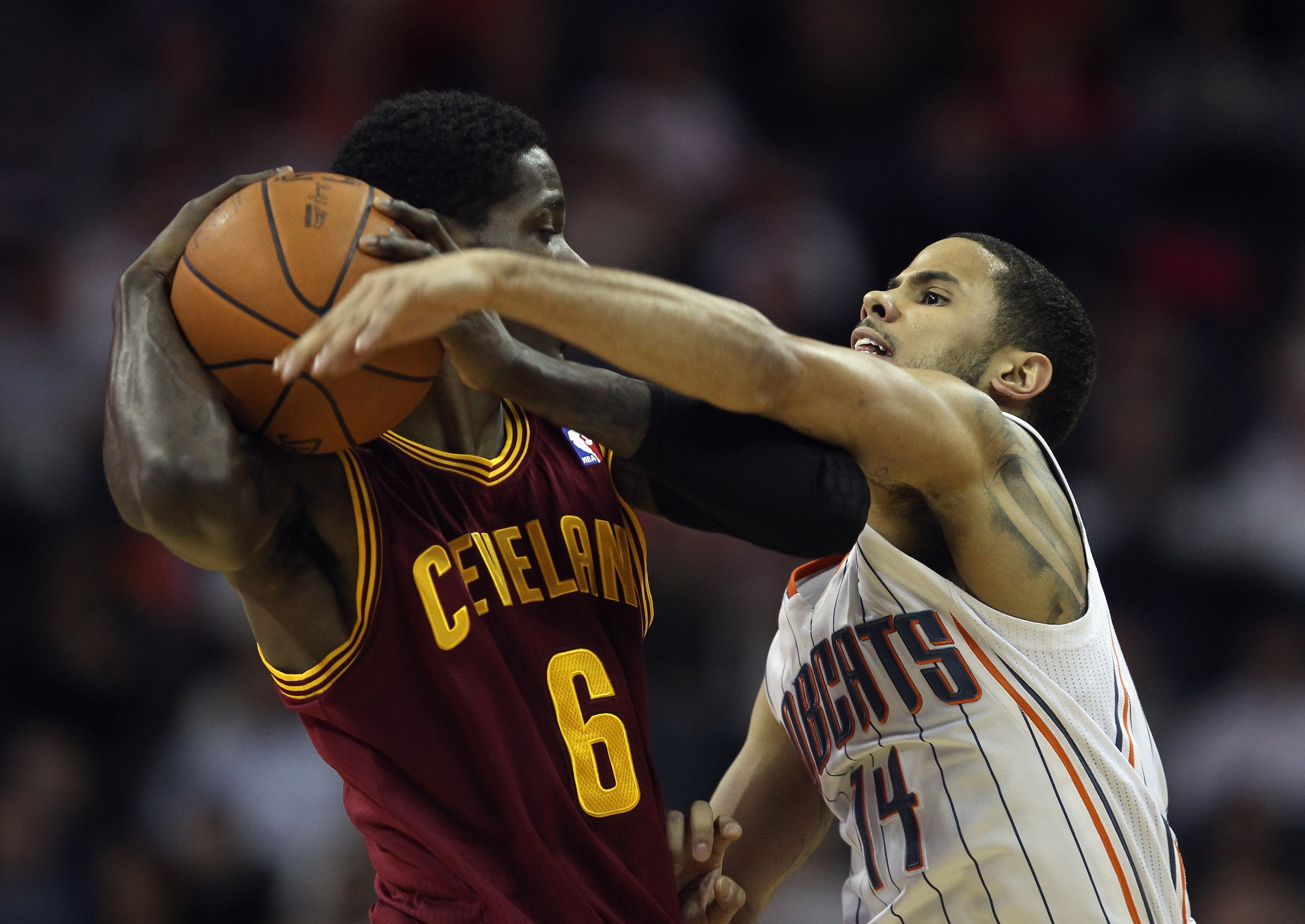 CHARLOTTE, NC - DECEMBER 29: Manny Harris #6 of the Cleveland Cavaliers tries to keep the ball away from D.J. Augustin #14 of the Charlotte Bobcats during their game at Time Warner Cable Arena on December 29, 2010 in Charlotte, North Carolina. NOTE TO US CHARLOTTE, NC - DECEMBER 29: Manny Harris #6 of the Cleveland Cavaliers tries to keep the ball away from D.J. Augustin #14 of the Charlotte Bobcats during their game at Time Warner Cable Arena on December 29, 2010 in Charlotte, North Carolina. NOTE TO US