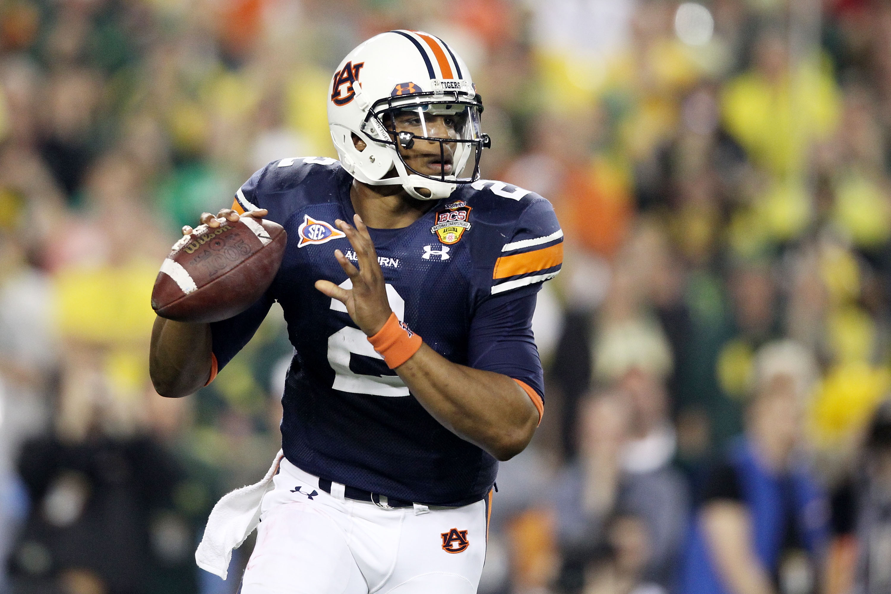 GLENDALE, AZ - JANUARY 10: Cameron Newton #2 of the Auburn Tigers scrambles against the Oregon Ducks during the Tostitos BCS National Championship Game at University of Phoenix Stadium on January 10, 2011 in Glendale, Arizona. (Photo by Christian Peters
