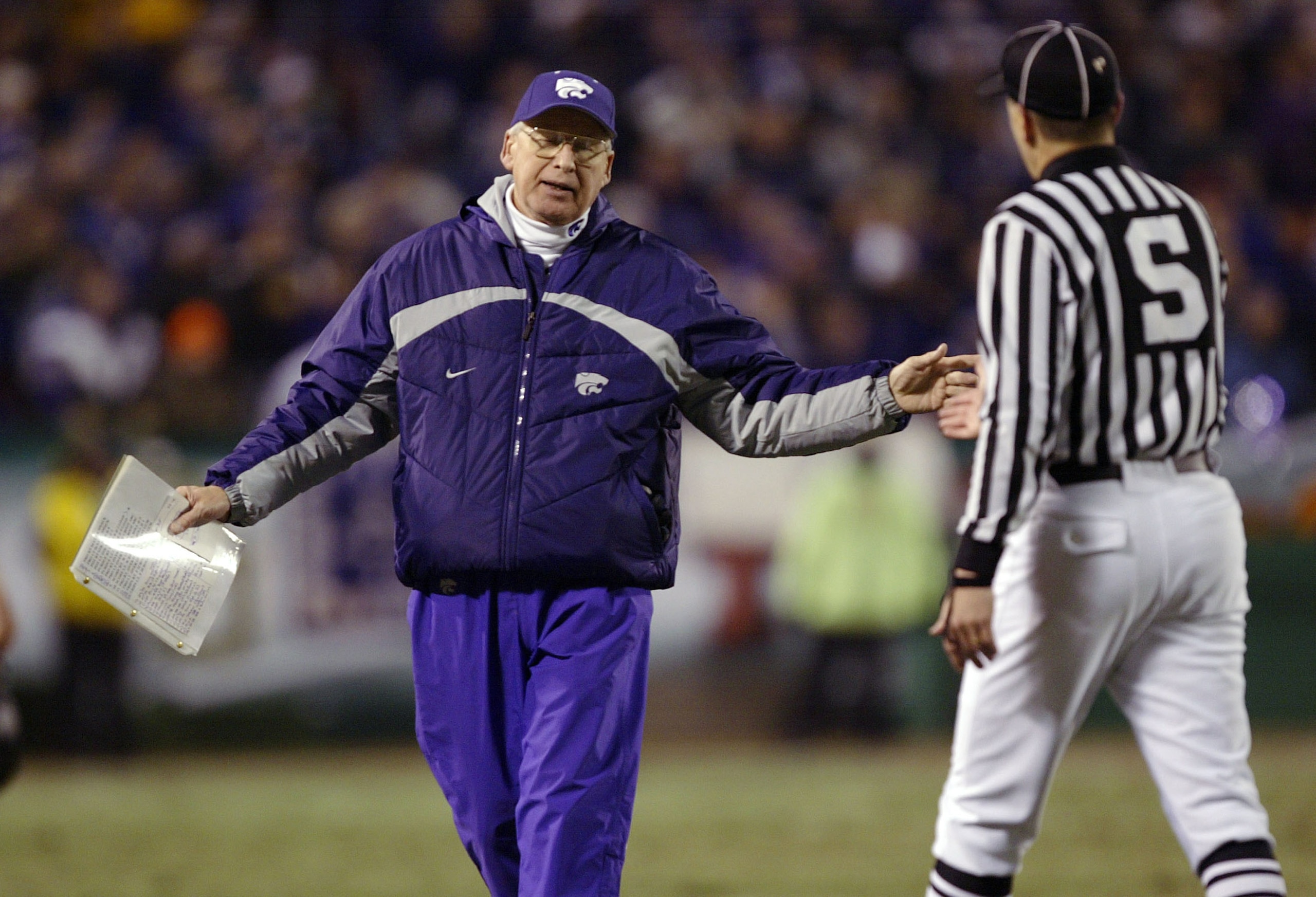 KANSAS CITY, MO - DECEMBER 6: Head coach Bill Synder of the Kansas State Wildcats questions a sideline judge after an interference penalty in favor of the Oklahoma Sooners during the second quarter of the Dr. Pepper Big 12 Championship December 6, 2003 a KANSAS CITY, MO - DECEMBER 6: Head coach Bill Synder of the Kansas State Wildcats questions a sideline judge after an interference penalty in favor of the Oklahoma Sooners during the second quarter of the Dr. Pepper Big 12 Championship December 6, 2003 a