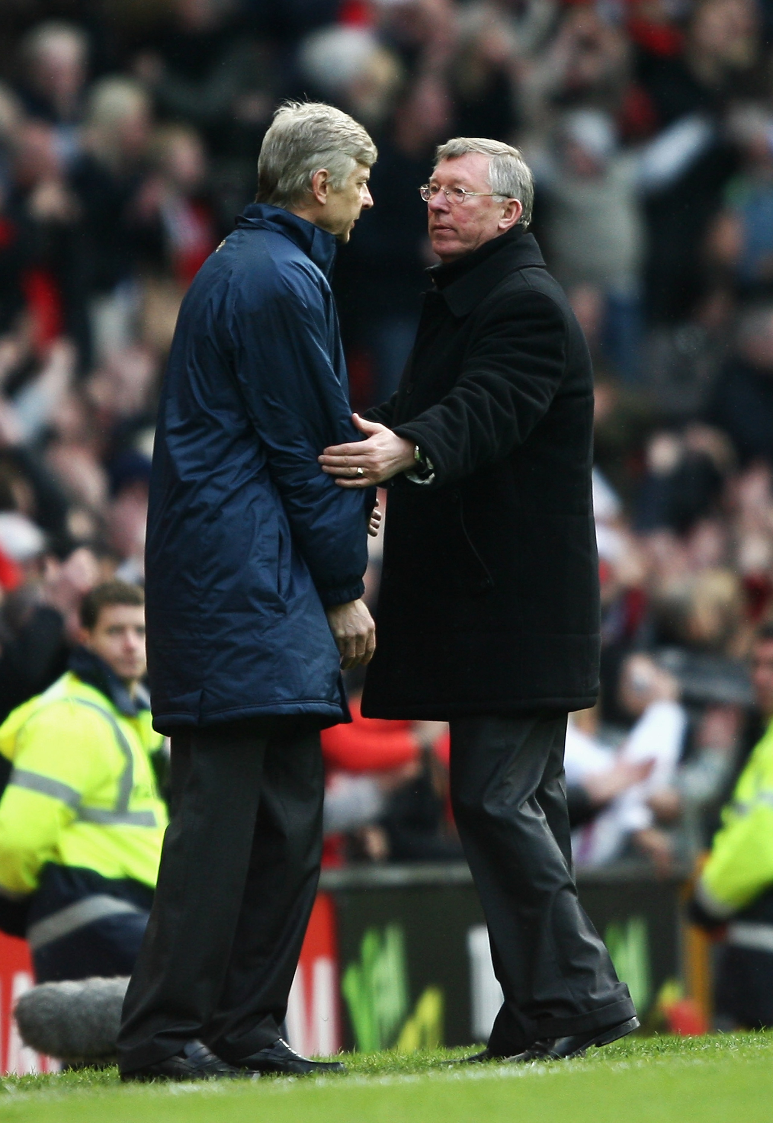 MANCHESTER, UNITED KINGDOM - APRIL 13:  Sir Alex Ferguson, manager of Manchester United consoles Arsene Wenger, manager of Arsenal after the Barclays Premier League match between Manchester United and Arsenal at Old Trafford on April 13, 2008 in Mancheste