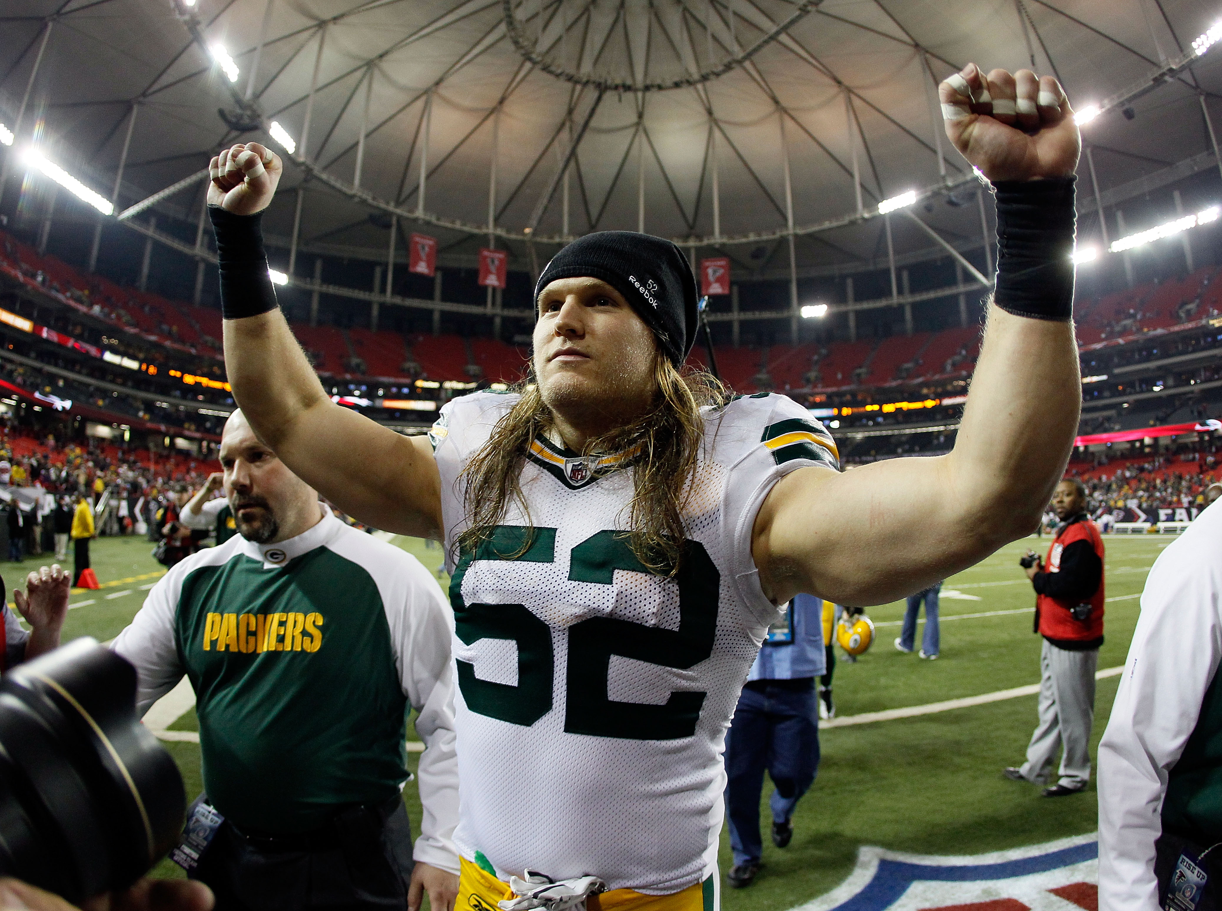 ATLANTA, GA - JANUARY 15:  Clay Matthews #52 of the Green Bay Packers celebrates as he walks off the field after the Packers won 48-21 against the Atlanta Falcons during their 2011 NFC divisional playoff game at Georgia Dome on January 15, 2011 in Atlanta