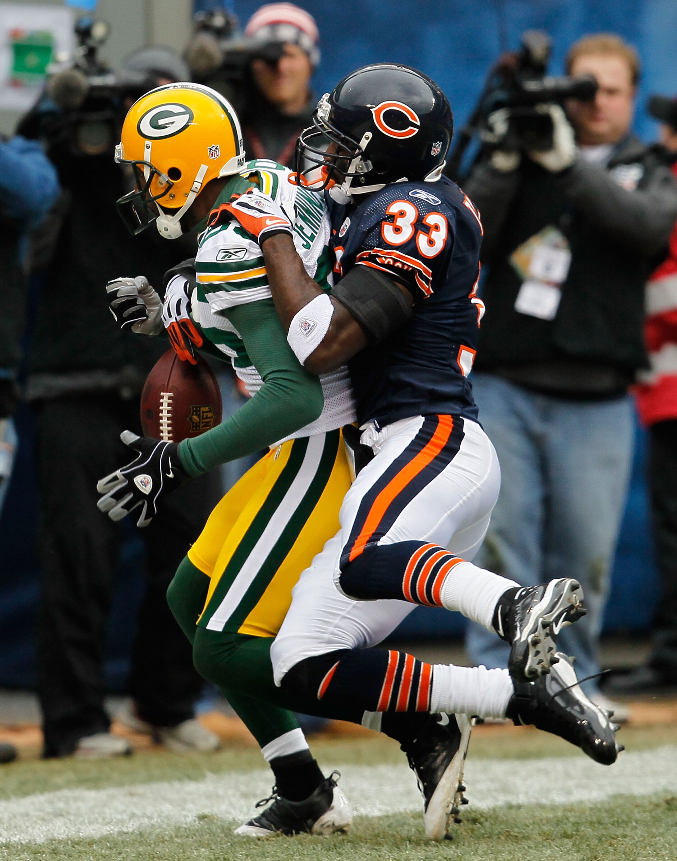 CHICAGO - DECEMBER 13: Greg Jennings #85 of the Green Bay Packers drops the ball in the end zone under pressure from Charles Tillman #33 of the Chicago Bears at Soldier Field on December 13, 2009 in Chicago, Illinois. The Packers defeated the Bears 21-14.