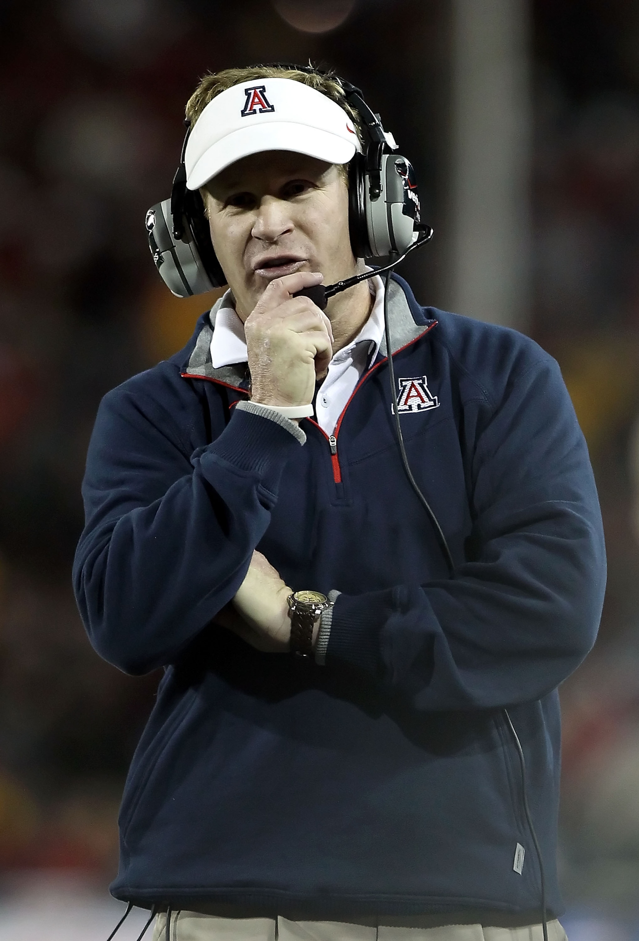 TUCSON, AZ - DECEMBER 02: Head coach Mike Stoops of the Arizona Wildcats during the college football game against the Arizona State Sun Devils at Arizona Stadium on December 2, 2010 in Tucson, Arizona. The Sun Devils defeated the Wildcats 30-29 in double TUCSON, AZ - DECEMBER 02: Head coach Mike Stoops of the Arizona Wildcats during the college football game against the Arizona State Sun Devils at Arizona Stadium on December 2, 2010 in Tucson, Arizona. The Sun Devils defeated the Wildcats 30-29 in double