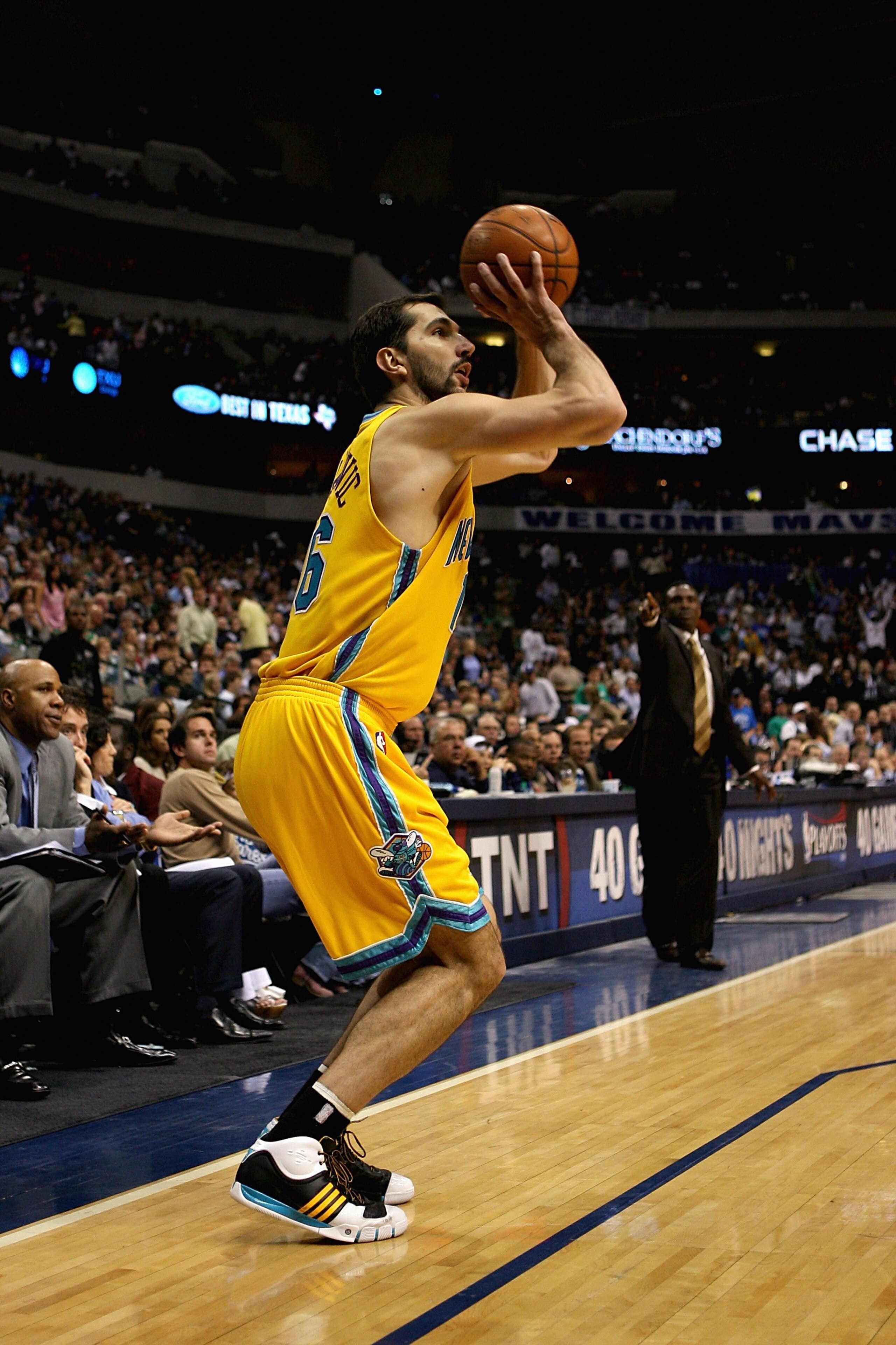 DALLAS - APRIL 27:  Peja Stojakovic #16 of the New Orleans Hornets shoots a three point shot in Game Four of the Western Conference Quarterfinals against the Dallas Mavericks during the 2008 NBA Playoffs at the American Airlines Center on April 27, 2008 i