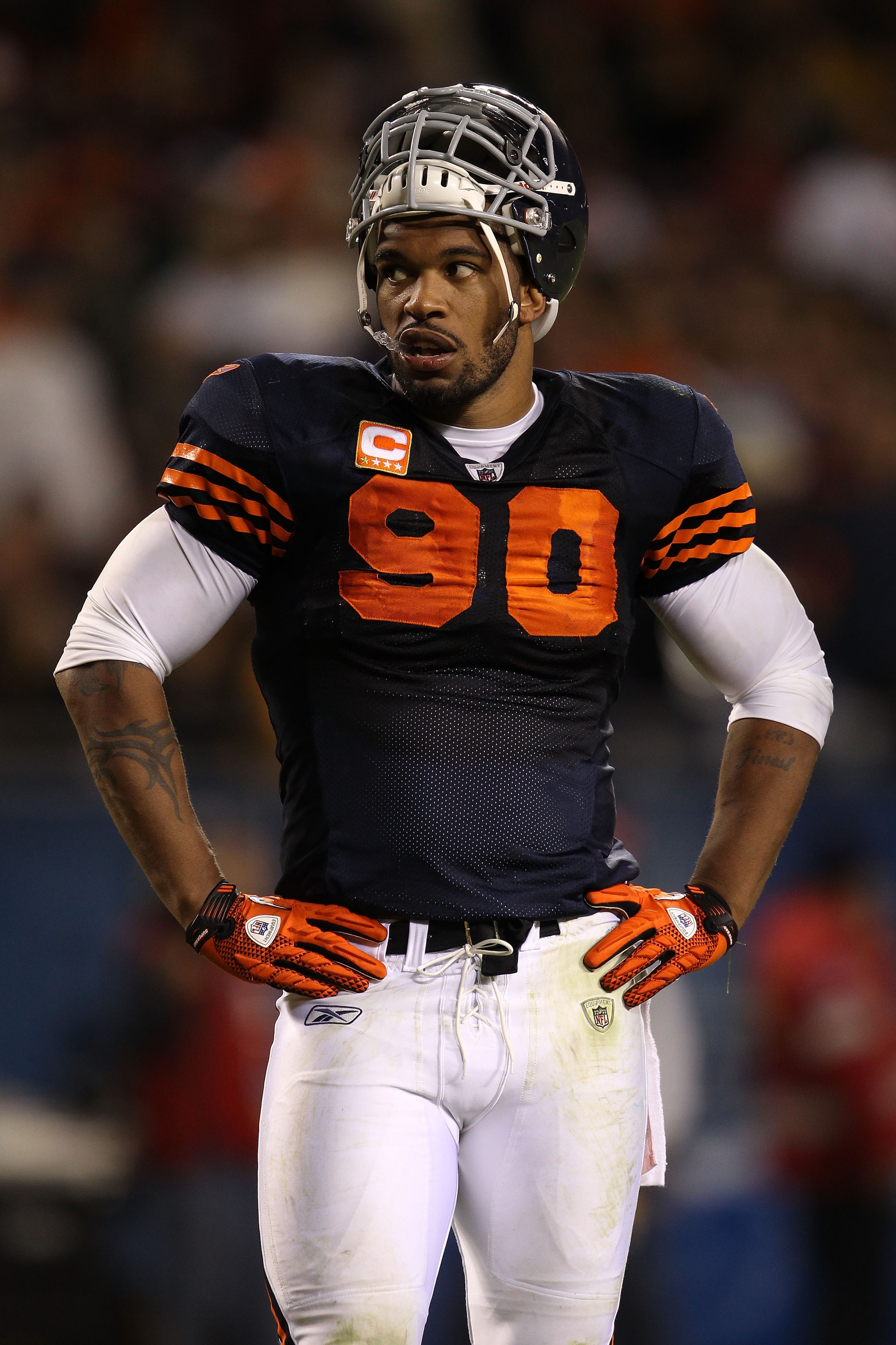 CHICAGO - SEPTEMBER 27:  Julius Peppers #90 of the Chicago Bears looks on against the Green Bay Packers at Soldier Field on September 27, 2010 in Chicago, Illinois.  (Photo by Jonathan Daniel/Getty Images)
