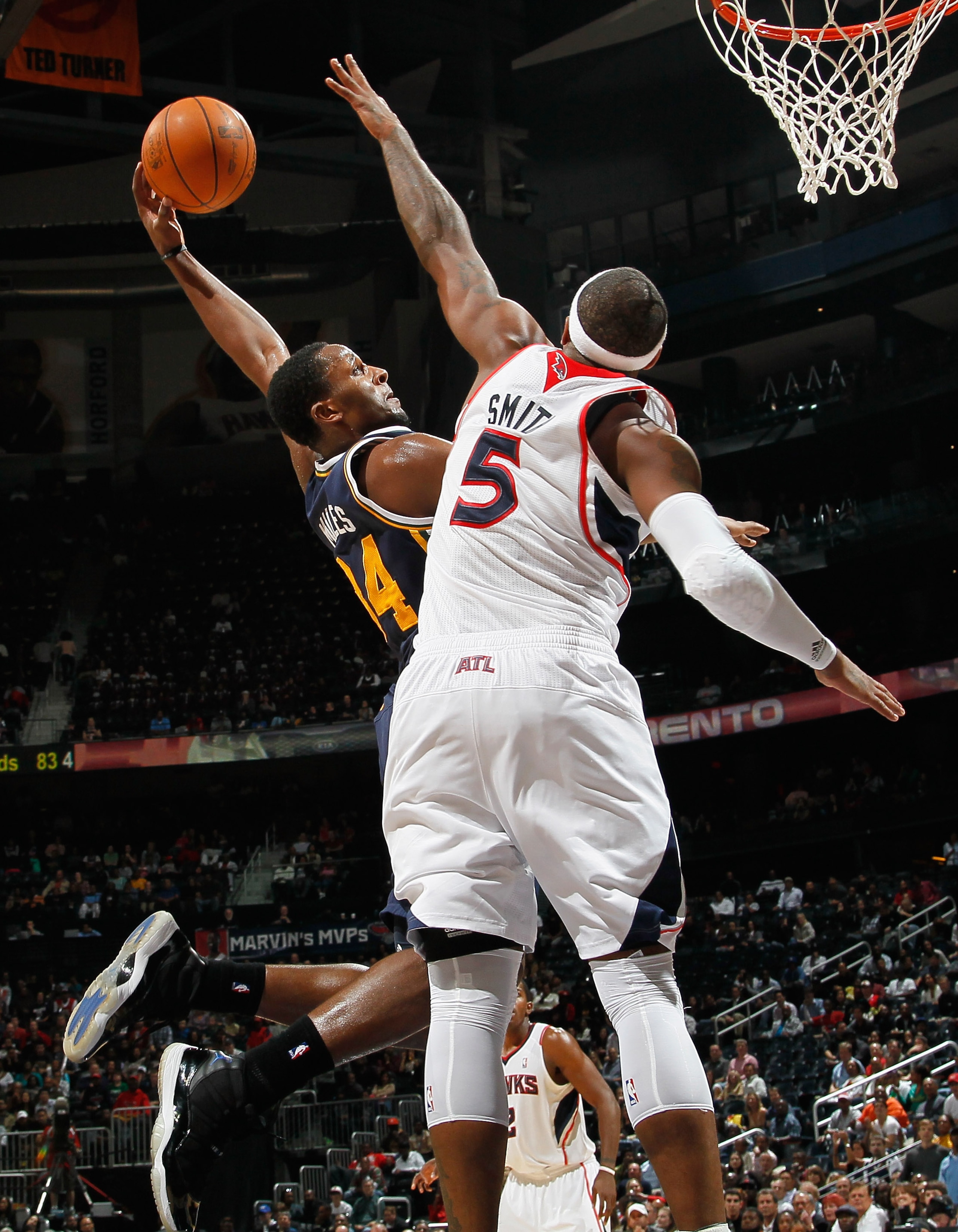 ATLANTA - NOVEMBER 12: Josh Smith #5 of the Atlanta Hawks leaps to block a dunk by C.J. Miles #34 of the Utah Jazz at Philips Arena on November 12, 2010 in Atlanta, Georgia. NOTE TO USER: User expressly acknowledges and agrees that, by downloading and/o ATLANTA - NOVEMBER 12: Josh Smith #5 of the Atlanta Hawks leaps to block a dunk by C.J. Miles #34 of the Utah Jazz at Philips Arena on November 12, 2010 in Atlanta, Georgia. NOTE TO USER: User expressly acknowledges and agrees that, by downloading and/o