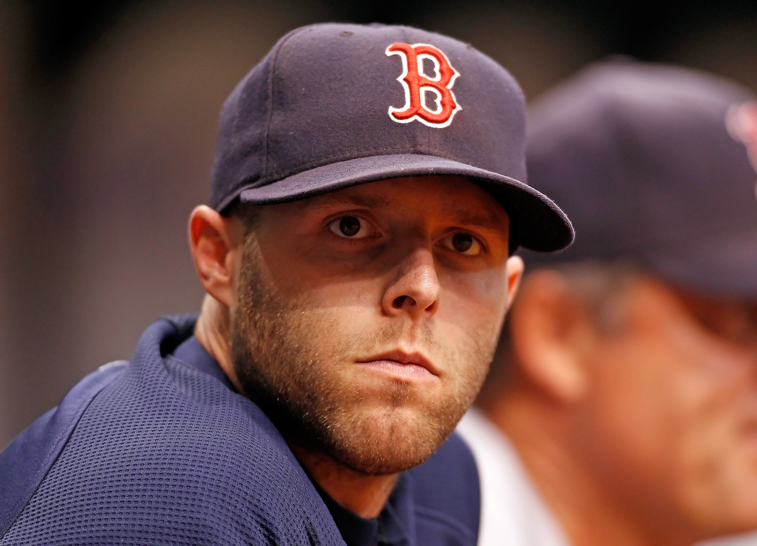 ST. PETERSBURG - JULY 07:  Injured infielder Dustin Pedroia #15 of the Boston Red Sox watches his team against the Tampa Bay Rays during the game at Tropicana Field on July 7, 2010 in St. Petersburg, Florida.  (Photo by J. Meric/Getty Images)