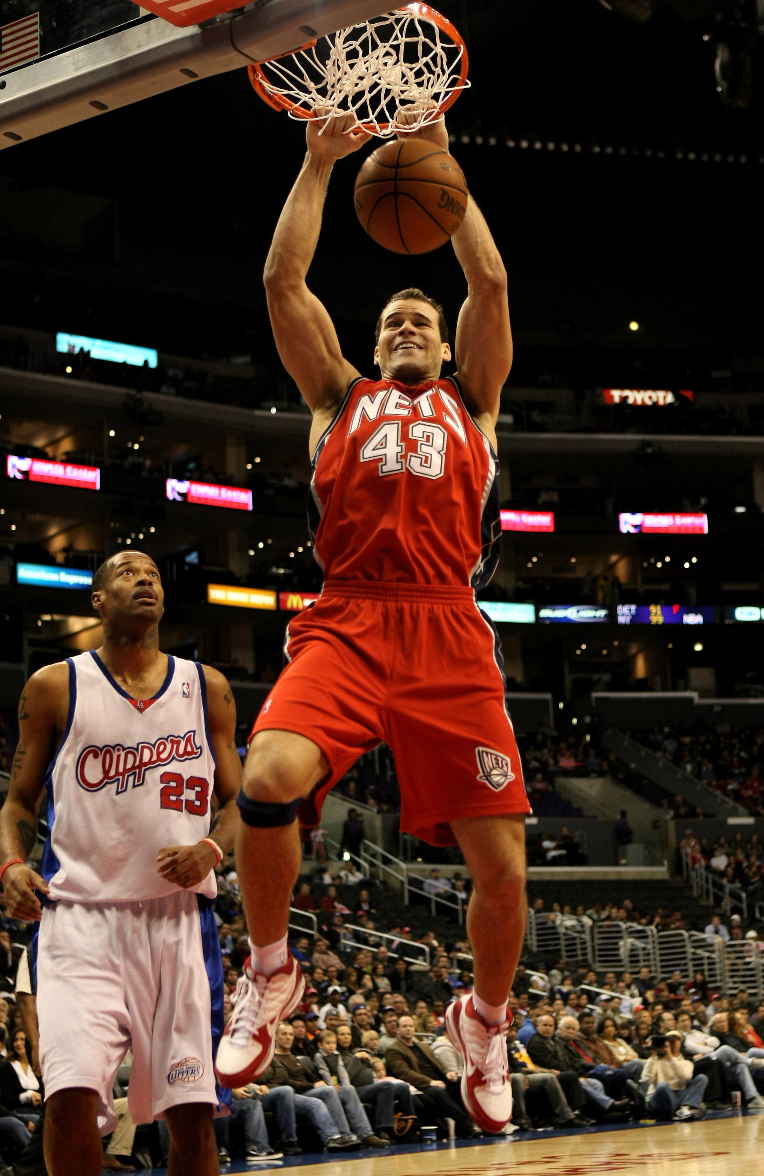 LOS ANGELES - JANUARY 18: Chris Humphries #43 of the New Jersey Nets dunks over Marcus Camby #23 of the Los Angeles Clippers on January 18, 2010 at Staples Center in Los Angeles, California. The Clippers won 106-95. NOTE TO USER: User expressly acknowl LOS ANGELES - JANUARY 18: Chris Humphries #43 of the New Jersey Nets dunks over Marcus Camby #23 of the Los Angeles Clippers on January 18, 2010 at Staples Center in Los Angeles, California. The Clippers won 106-95. NOTE TO USER: User expressly acknowl