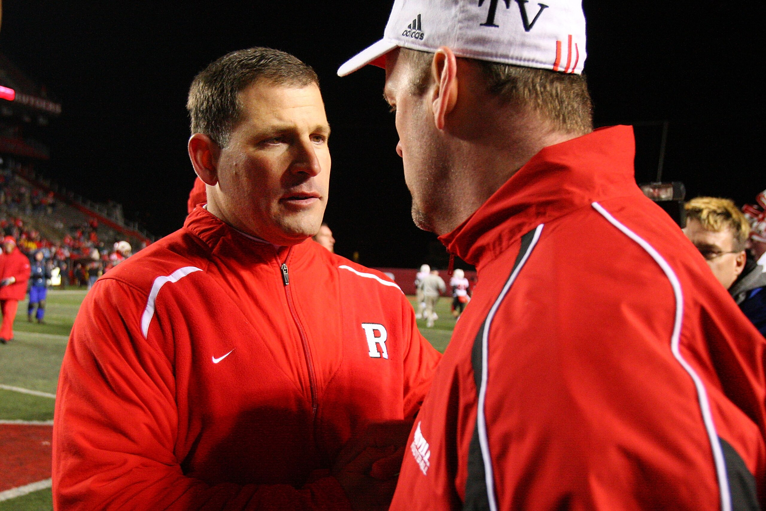 PISCATAWAY, NJ - DECEMBER 04: (L-R) Greg Schiano head coach of the Rutgers Scarlet Knights shakes hands with Steve Kragthorpe head coach of the Louisville Cardinals after the game at Rutgers Stadium on December 4, 2008 in Piscataway, New Jersey. (Photo PISCATAWAY, NJ - DECEMBER 04: (L-R) Greg Schiano head coach of the Rutgers Scarlet Knights shakes hands with Steve Kragthorpe head coach of the Louisville Cardinals after the game at Rutgers Stadium on December 4, 2008 in Piscataway, New Jersey. (Photo