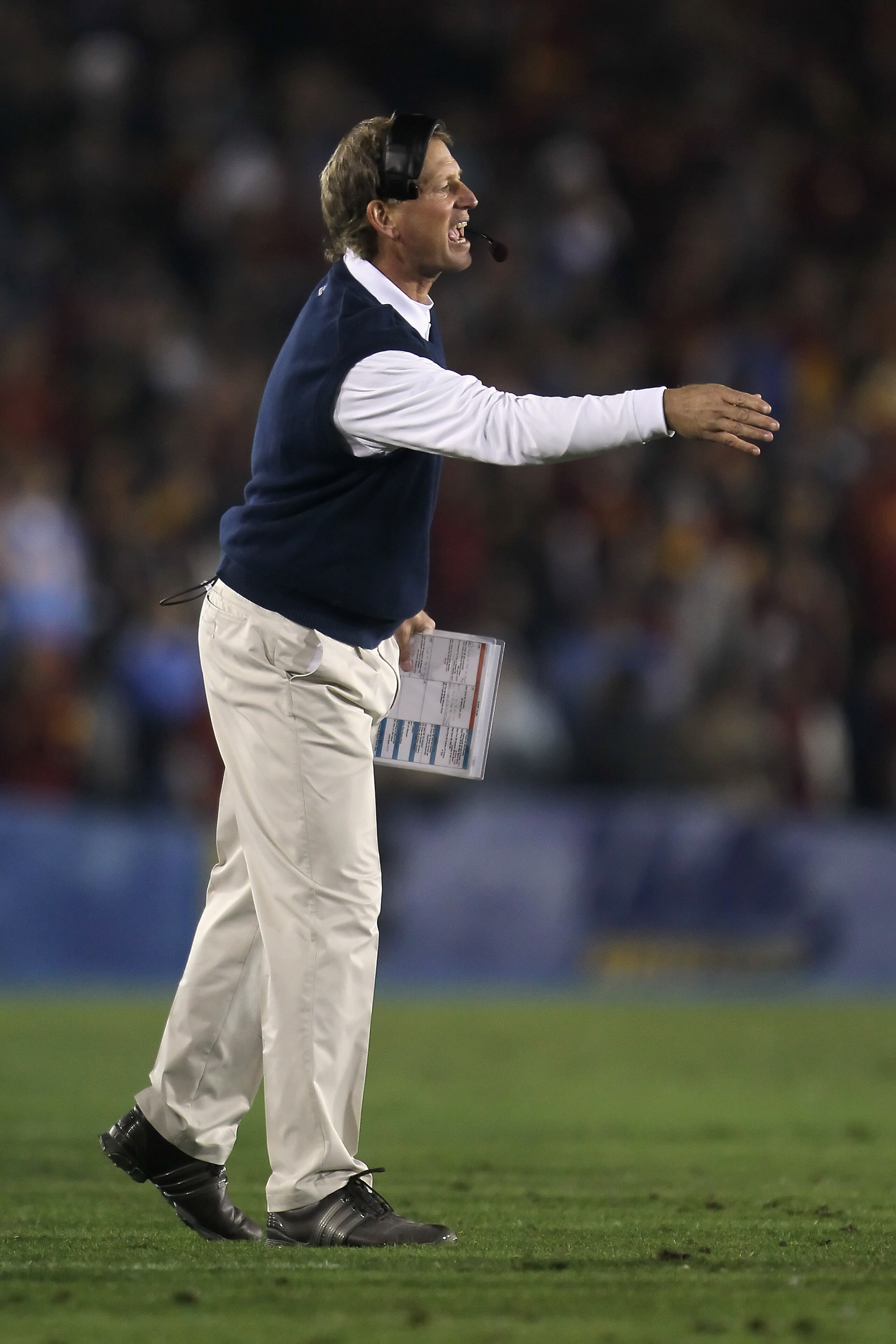 PASADENA, CA - DECEMBER 04: UCLA Bruins head coach Rick Neuheisel yells from the sideline against the USC Trojans at the Rose Bowl on December 4, 2010 in Pasadena, California. USC defeated UCLA 28-14. (Photo by Jeff Gross/Getty Images) PASADENA, CA - DECEMBER 04: UCLA Bruins head coach Rick Neuheisel yells from the sideline against the USC Trojans at the Rose Bowl on December 4, 2010 in Pasadena, California. USC defeated UCLA 28-14. (Photo by Jeff Gross/Getty Images)