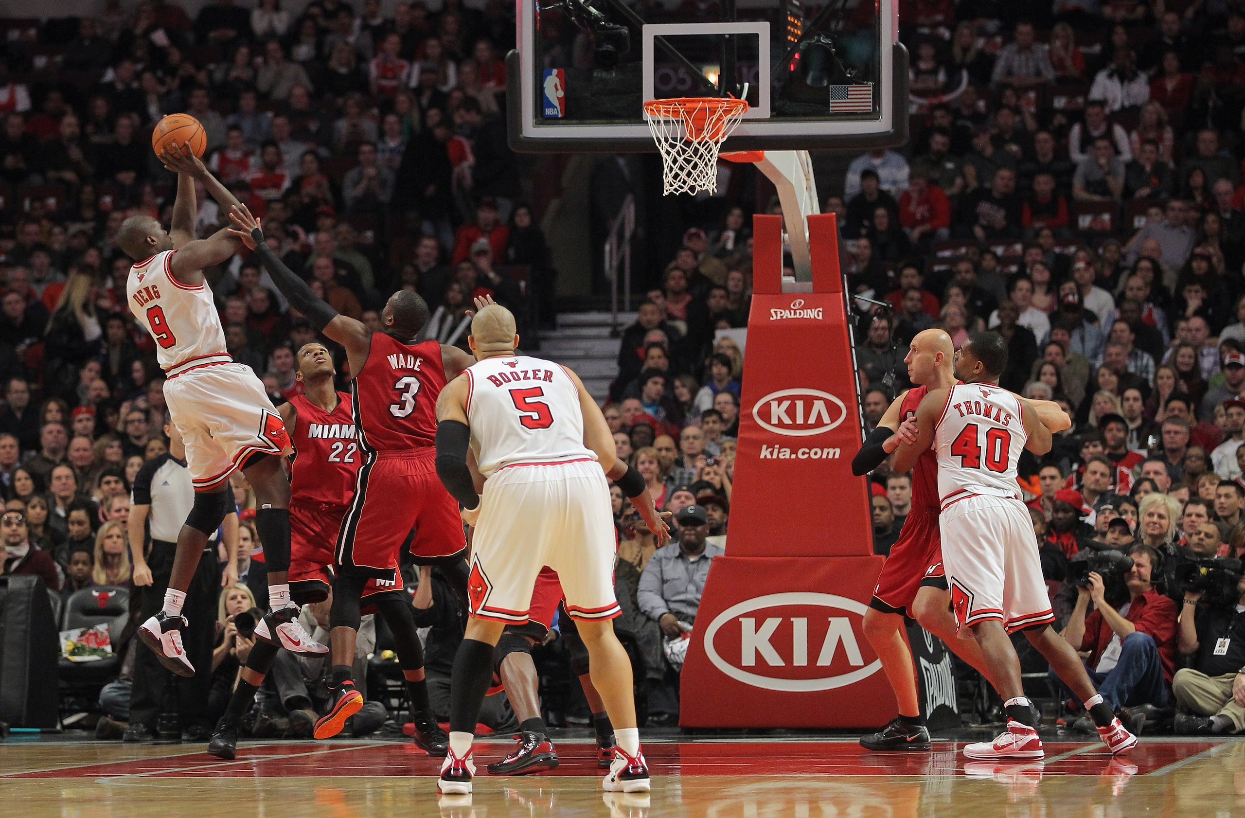 CHICAGO, IL - JANUARY 15: Luol Deng #9 of the Chicago Bulls takes a shot over Dwyane Wade #3 of the Miami Heat at the United Center on January 15, 2011 in Chicago, Illinois. NOTE TO USER: User expressly acknowledges and agrees that, by downloading and or CHICAGO, IL - JANUARY 15: Luol Deng #9 of the Chicago Bulls takes a shot over Dwyane Wade #3 of the Miami Heat at the United Center on January 15, 2011 in Chicago, Illinois. NOTE TO USER: User expressly acknowledges and agrees that, by downloading and or