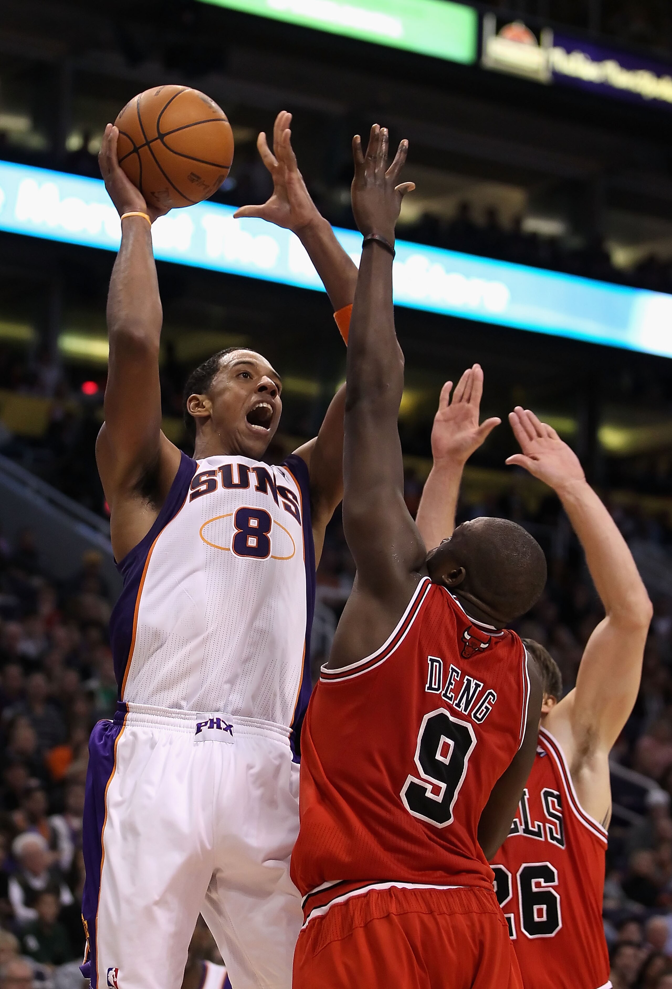 PHOENIX - NOVEMBER 24: Channing Frye #8 of the Phoenix Suns puts up a shot over Luol Deng #9 of the Chicago Bulls during the NBA game at US Airways Center on November 24, 2010 in Phoenix, Arizona. The Bulls defeated the Suns 123-115 in double overtime. PHOENIX - NOVEMBER 24: Channing Frye #8 of the Phoenix Suns puts up a shot over Luol Deng #9 of the Chicago Bulls during the NBA game at US Airways Center on November 24, 2010 in Phoenix, Arizona. The Bulls defeated the Suns 123-115 in double overtime.