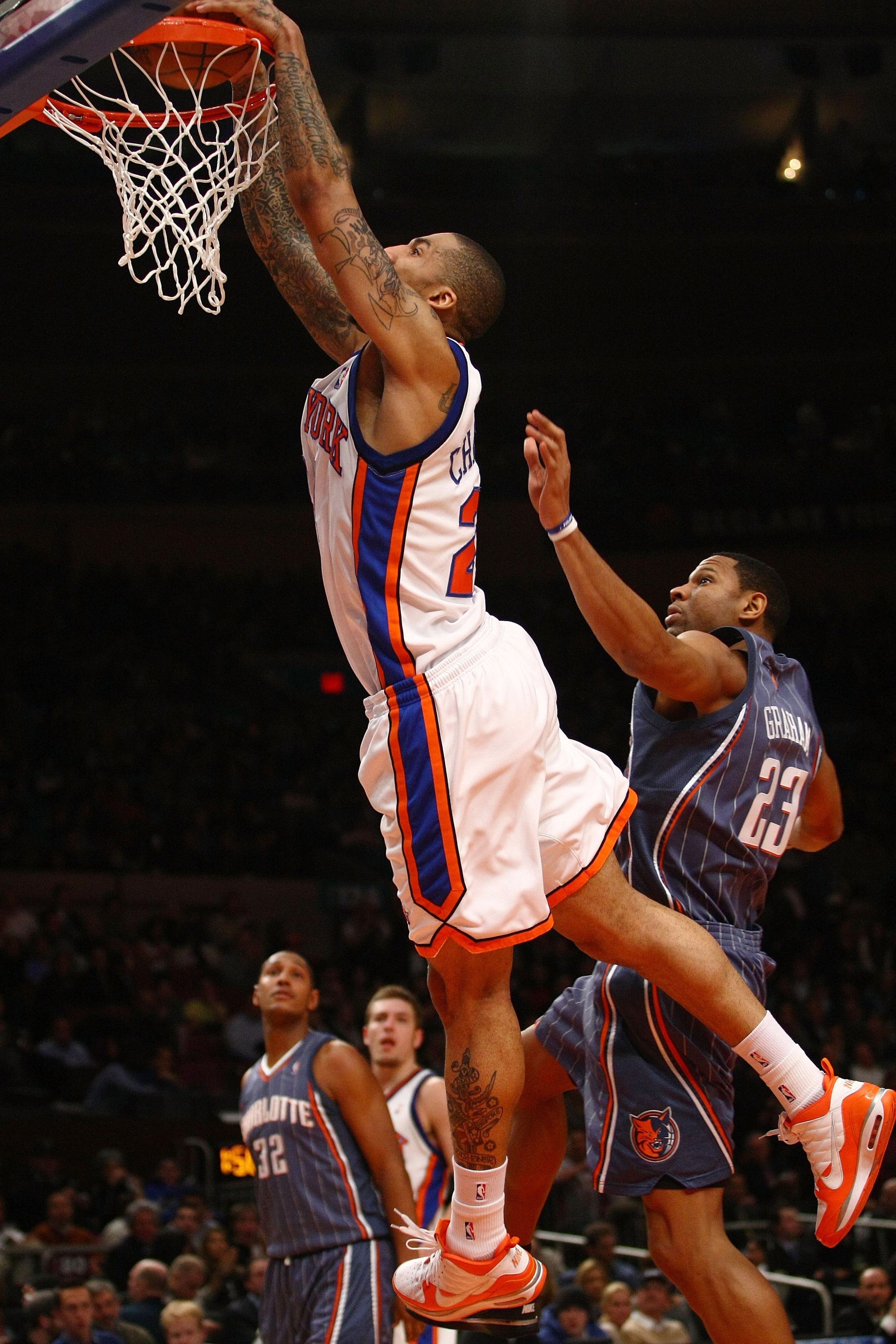 NEW YORK - JANUARY 07: Wilson Chandler #21 of the New York Knicks dunks over Stephen Graham #23 of the Charlotte Bobcats at Madison Square Garden January 7, 2010 in New York City. NOTE TO USER: User expressly acknowledges and agrees that, by downloading NEW YORK - JANUARY 07: Wilson Chandler #21 of the New York Knicks dunks over Stephen Graham #23 of the Charlotte Bobcats at Madison Square Garden January 7, 2010 in New York City. NOTE TO USER: User expressly acknowledges and agrees that, by downloading