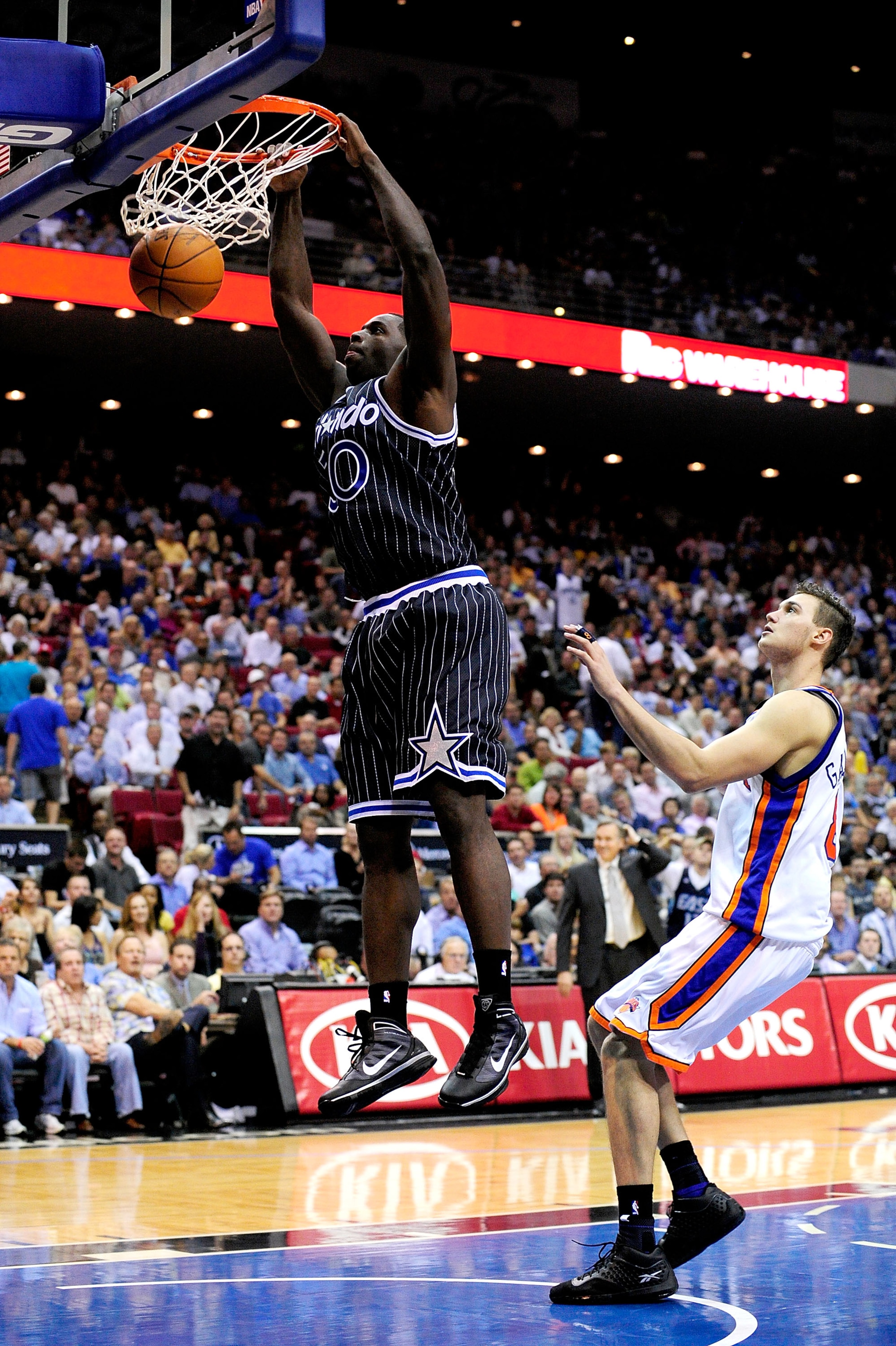 ORLANDO, FL - DECEMBER 02: Brandon Bass #30 of the Orlando Magic scores over Danilo Gallinari #8 of the New York Knicks during the game at Amway Arena on December 2, 2009 in Orlando, Florida. NOTE TO USER: User expressly acknowledges and agrees that, by ORLANDO, FL - DECEMBER 02: Brandon Bass #30 of the Orlando Magic scores over Danilo Gallinari #8 of the New York Knicks during the game at Amway Arena on December 2, 2009 in Orlando, Florida. NOTE TO USER: User expressly acknowledges and agrees that, by