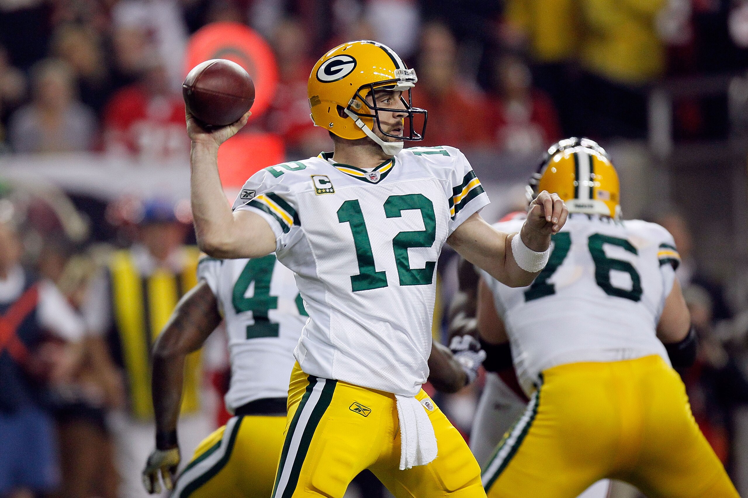 ATLANTA, GA - JANUARY 15:  Quarterback Aaron Rodgers #12  of the Green Bay Packers throws a pass against the Atlanta Falcons during their 2011 NFC divisional playoff game at Georgia Dome on January 15, 2011 in Atlanta, Georgia.  (Photo by Kevin C. Cox/Get