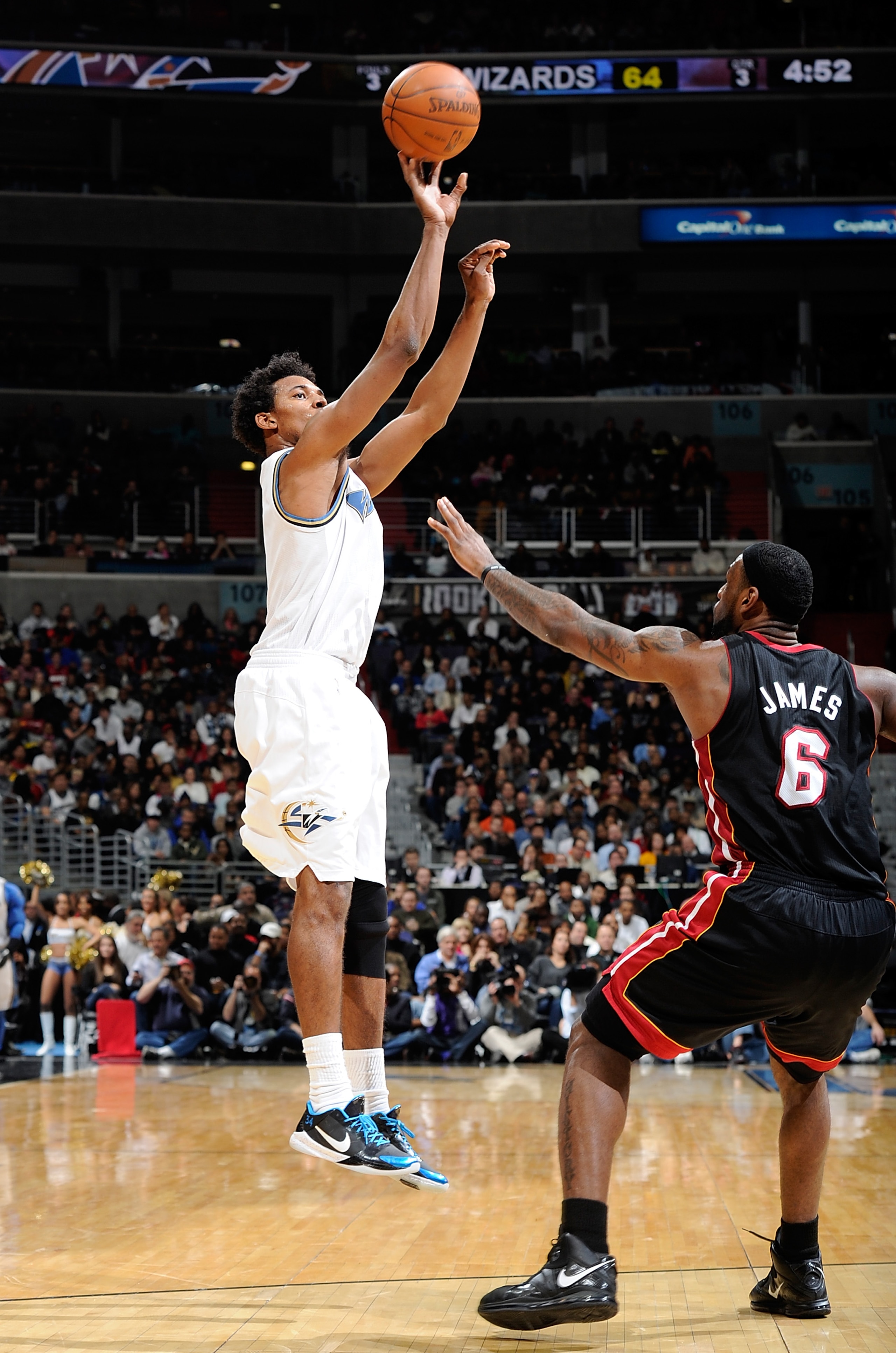 WASHINGTON - DECEMBER 18: Nick Young #1 of the Washington Wizards shoots over Lebron James #6 of the Miami Heat at the Verizon Center on December 18, 2010 in Washington, DC.NOTE TO USER: User expressly acknowledges and agrees that, by downloading and or WASHINGTON - DECEMBER 18: Nick Young #1 of the Washington Wizards shoots over Lebron James #6 of the Miami Heat at the Verizon Center on December 18, 2010 in Washington, DC.NOTE TO USER: User expressly acknowledges and agrees that, by downloading and or