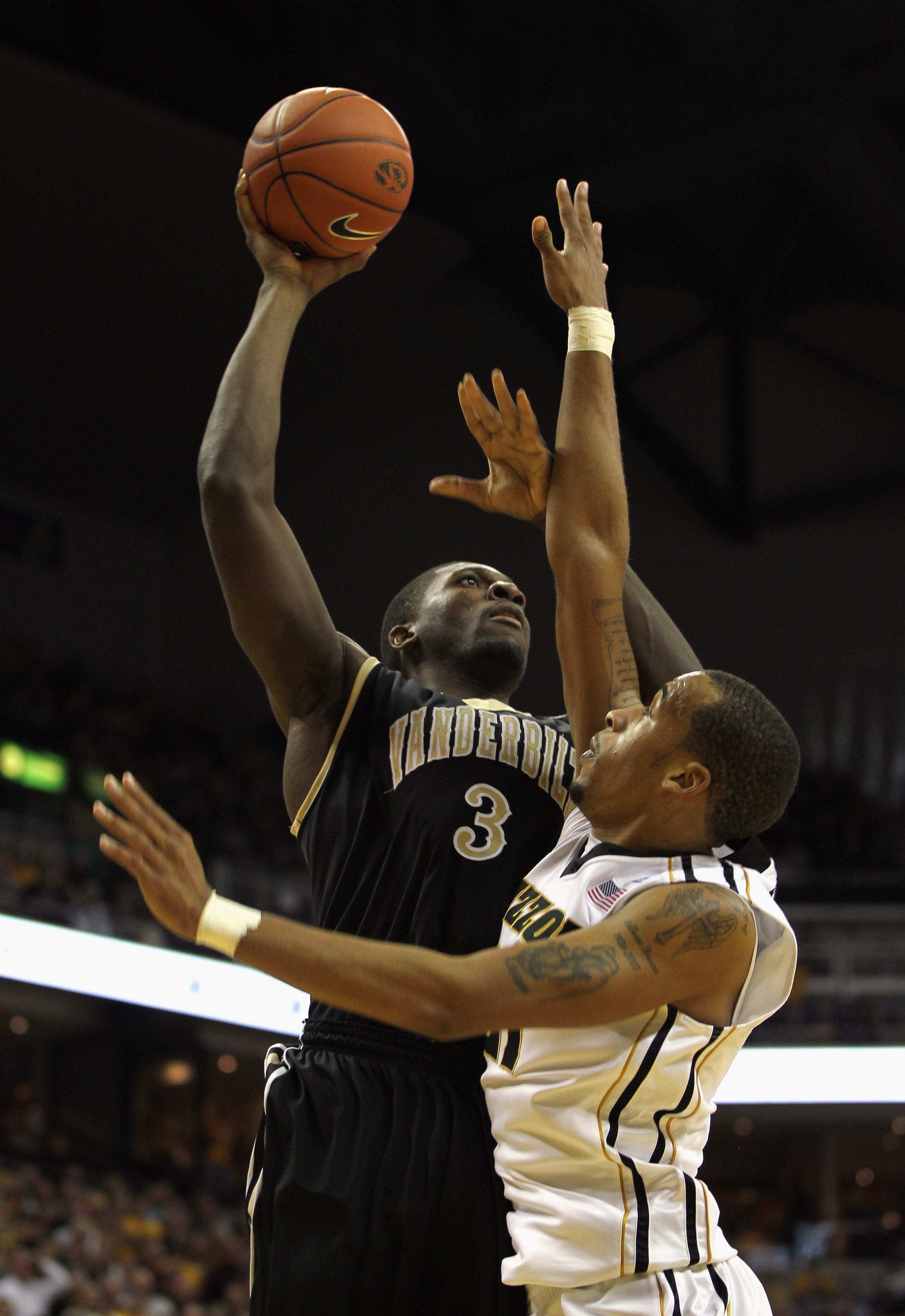 COLUMBIA, MO - DECEMBER 08:  Festus Ezeli #3 of the Vanderbilt Commodores shoots over Laurence Bowers #21 of the Missouri Tigers during the game on December 8, 2010 at Mizzou Arena in Columbia, Missouri.  (Photo by Jamie Squire/Getty Images)