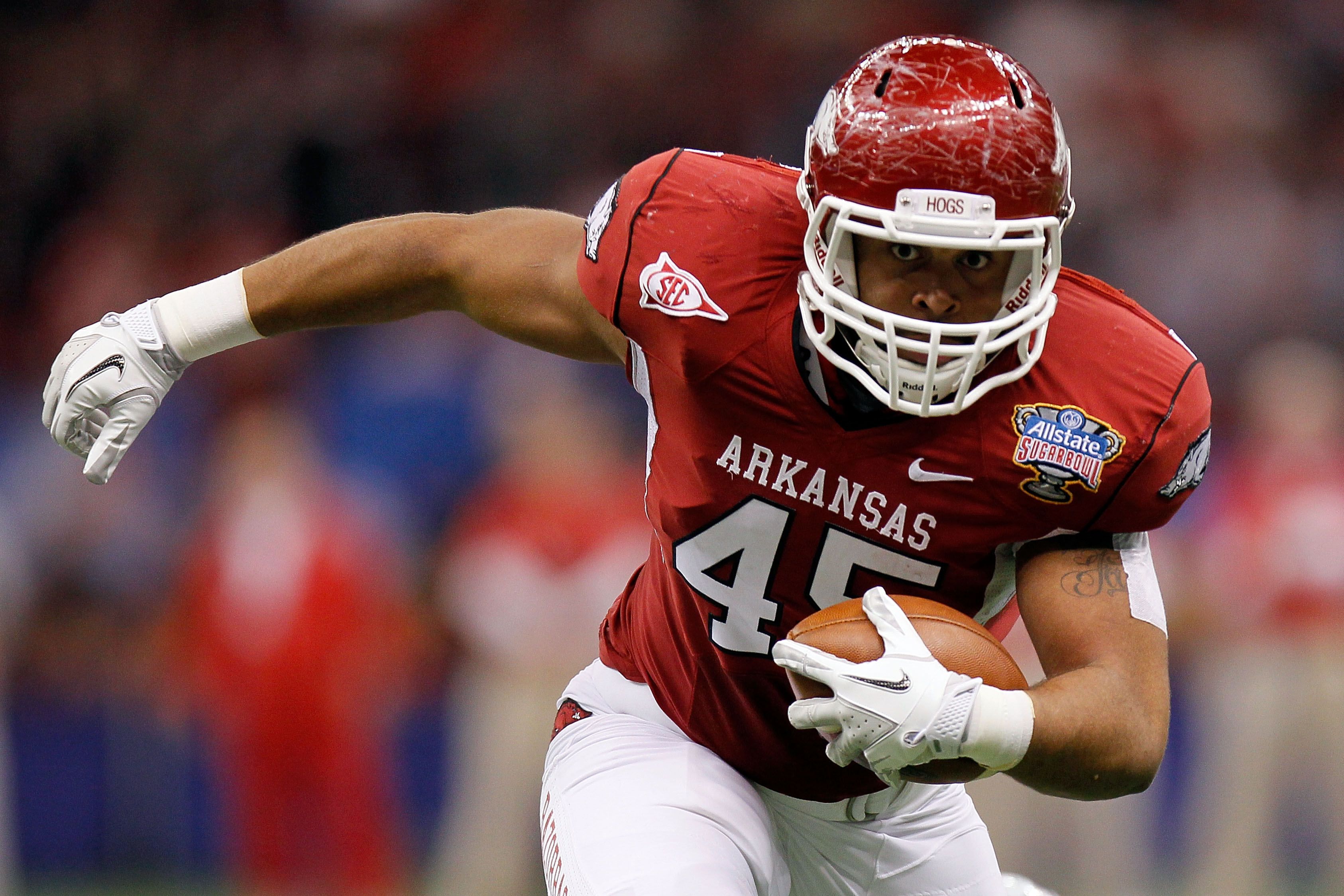 NEW ORLEANS, LA - JANUARY 04: D.J. Williams #45 of the Arkansas Razorbacks runs after a catch in the first half against the Ohio State Buckeyes during the Allstate Sugar Bowl at the Louisiana Superdome on January 4, 2011 in New Orleans, Louisiana. (Phot