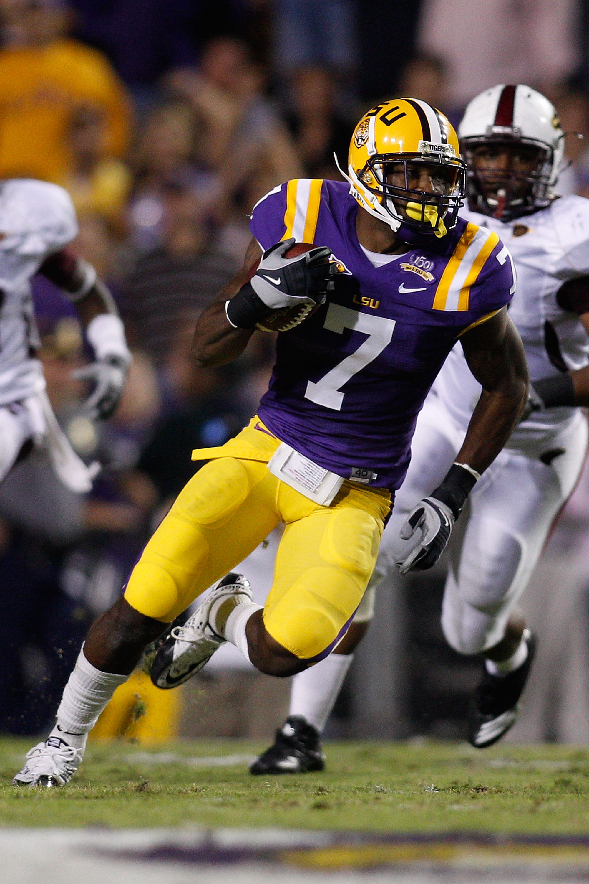 BATON ROUGE, LA - NOVEMBER 13: Patrick Peterson #7 of the Louisiana State University Tigers runs back an interception against the Louisiana Monroe Warhawks at Tiger Stadium on November 13, 2010 in Baton Rouge, Louisiana. (Photo by Chris Graythen/Getty I