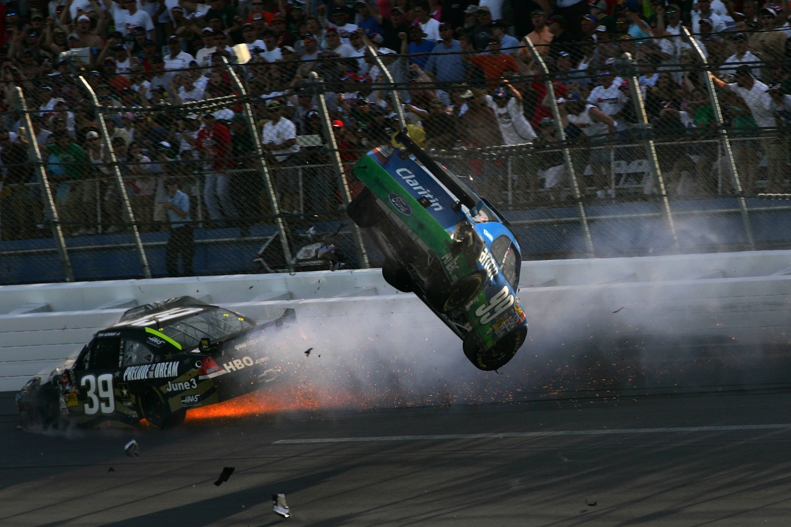 TALLADEGA, AL - APRIL 26:  Carl Edwards, driver of the #99 Claritin Ford goes airborne as Ryan Newman, driver of the #34 Stewart-Haas Racing Chevrolet hits the wall at the end of the NASCAR Sprint Cup Series Aaron's 499 at Talladega Superspeedway on April