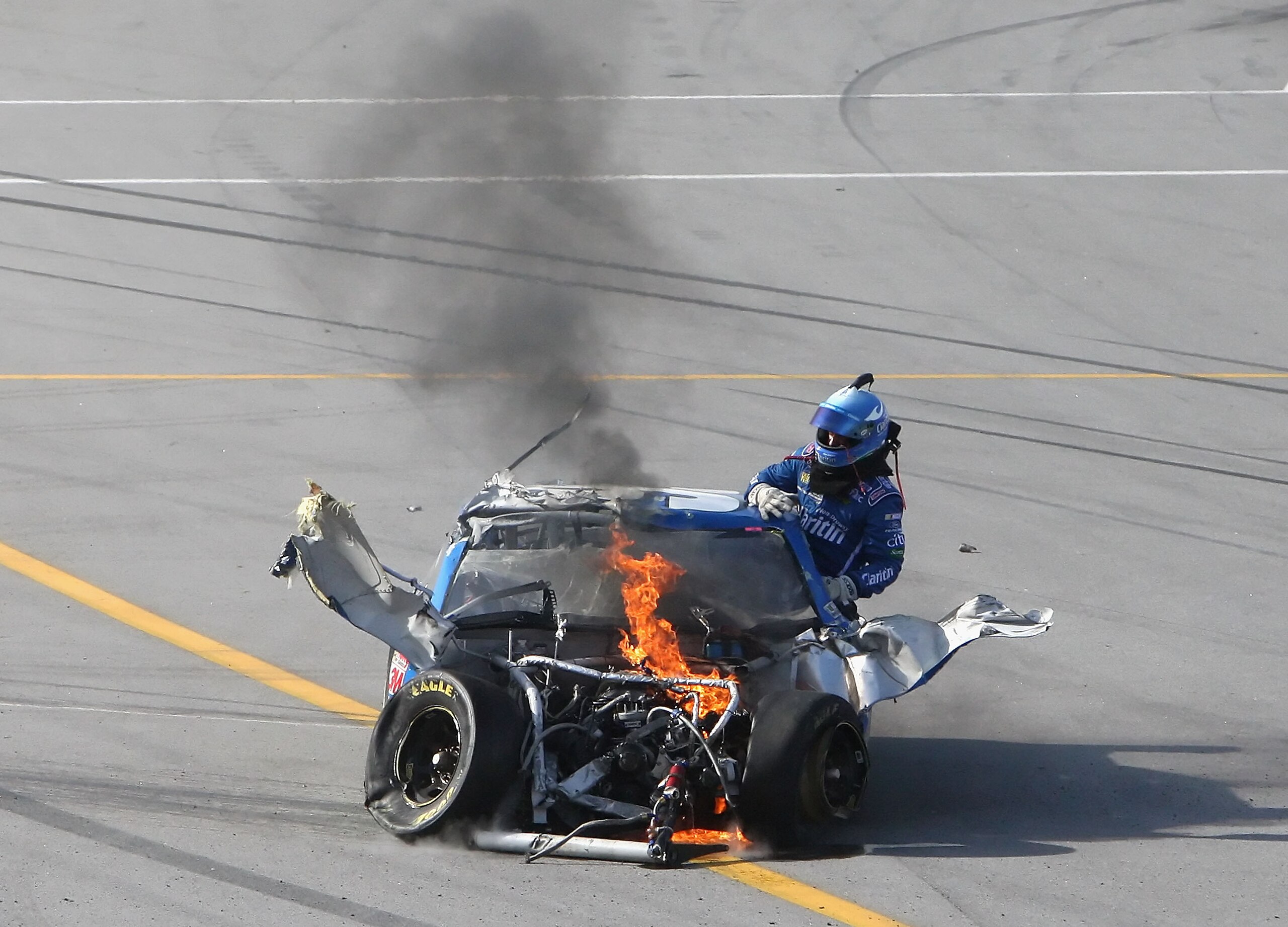 TALLADEGA, AL - APRIL 26:  Carl Edwards, climbs from the #99 Claritin Ford, after suffering damage at the conclusion of the NASCAR Sprint Cup Series Aaron's 499 at Talladega Superspeedway on April 26, 2009 in Talladega, Alabama.  (Photo by Christian Peter