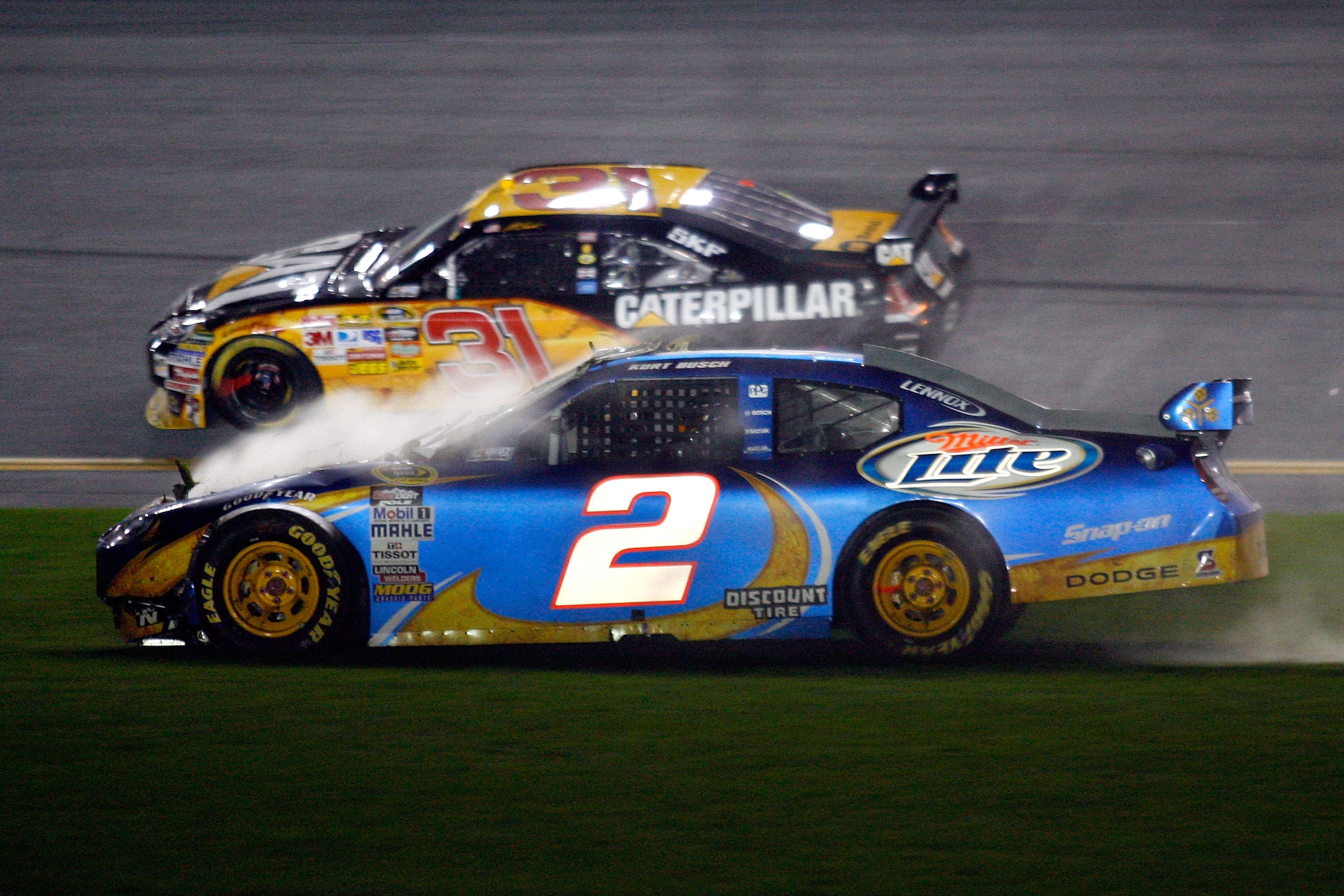 DAYTONA BEACH, FL - FEBRUARY 06:  Kurt Busch, driver of the #2 Miller Lite Dodge, drives through the infield grass after crashing during the Budweiser Shootout at Daytona International Speedway on February 6, 2010 in Daytona Beach, Florida.  (Photo by Jas