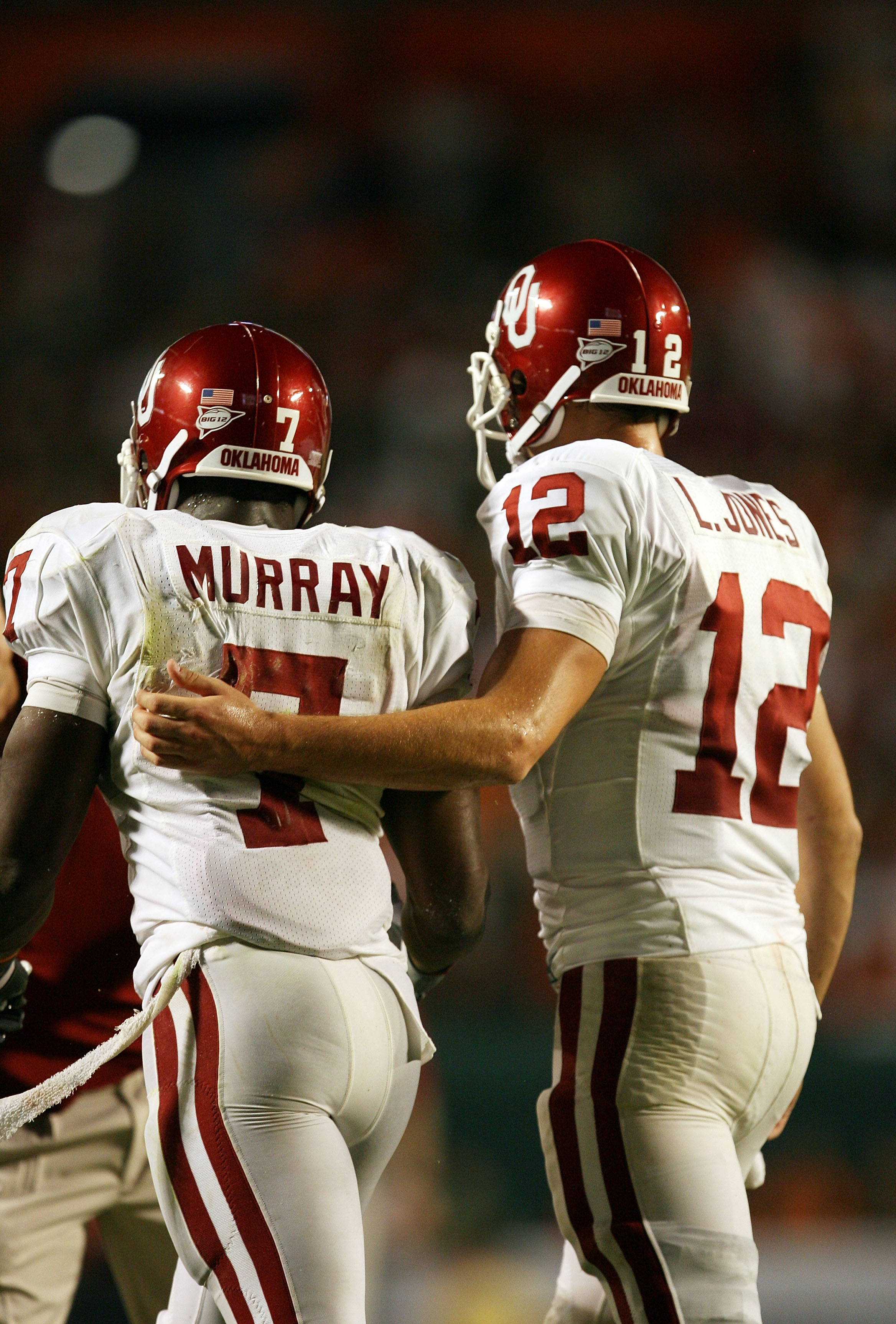 FORT LAUDERDALE, FL - OCTOBER 03: Quarterback Landry Jones #12 of the Oklahoma Sooners congratulates congratulates running back DeMarco Murray #7 after Murray's touchdown run in the third quarter against the Miami Hurricanes at Land Shark Stadium on Octob