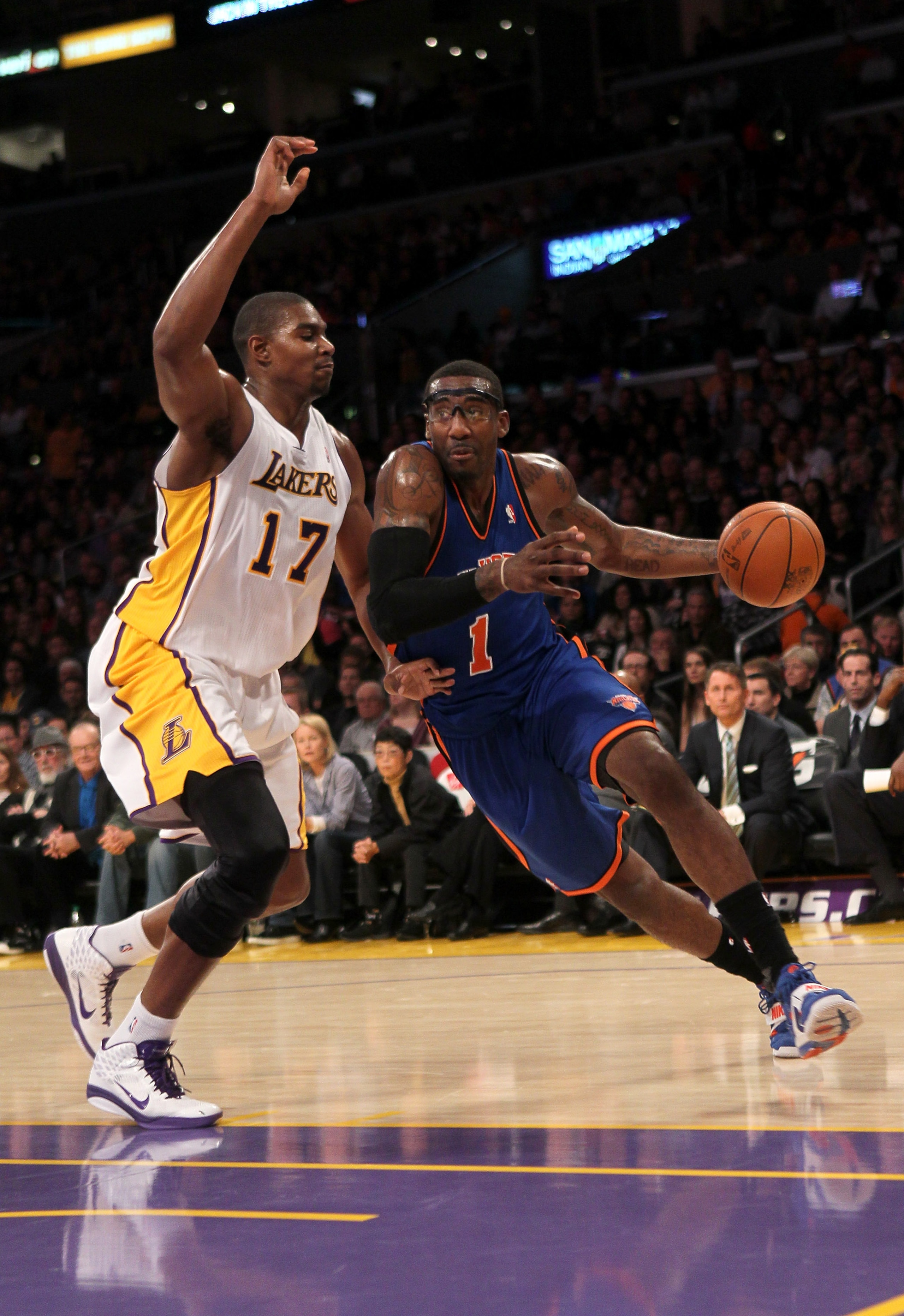 LOS ANGELES, CA - JANUARY 09:  Amar'e Stoudemire #1 of the New York Knicks drives around Andrew Bynum #17 of the Los Angeles Lakers at Staples Center on January 9, 2011 in Los Angeles, California.  The Lakers won 109-87.   NOTE TO USER: User expressly ack
