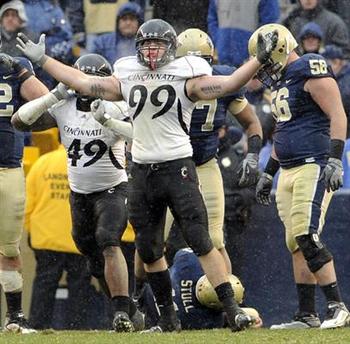 Bearcats DL Dan Giordano celebrates a tackle for less against Big East rival Pitt